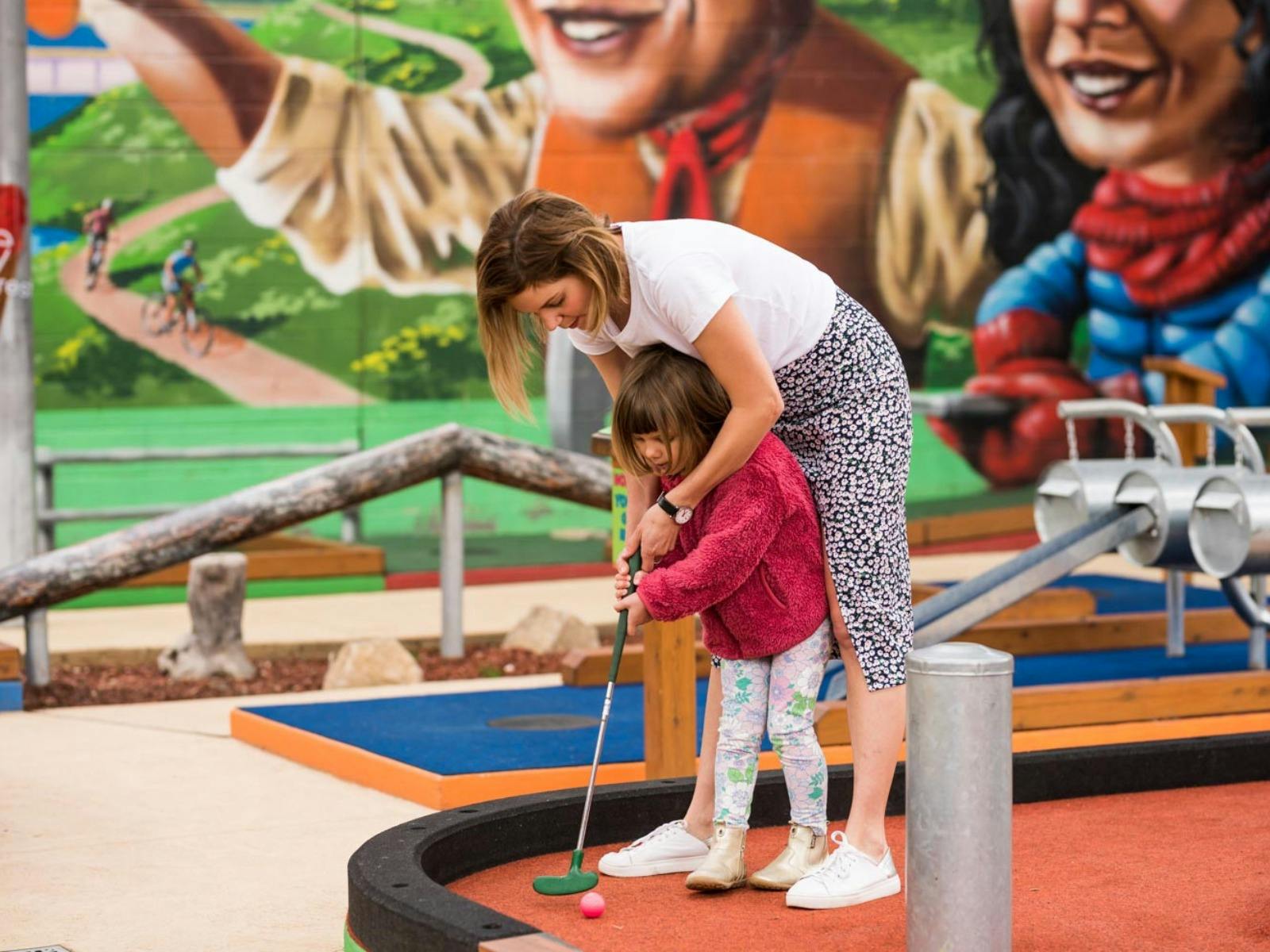 Woman and girl practising skills at Mansfield Mini Golf