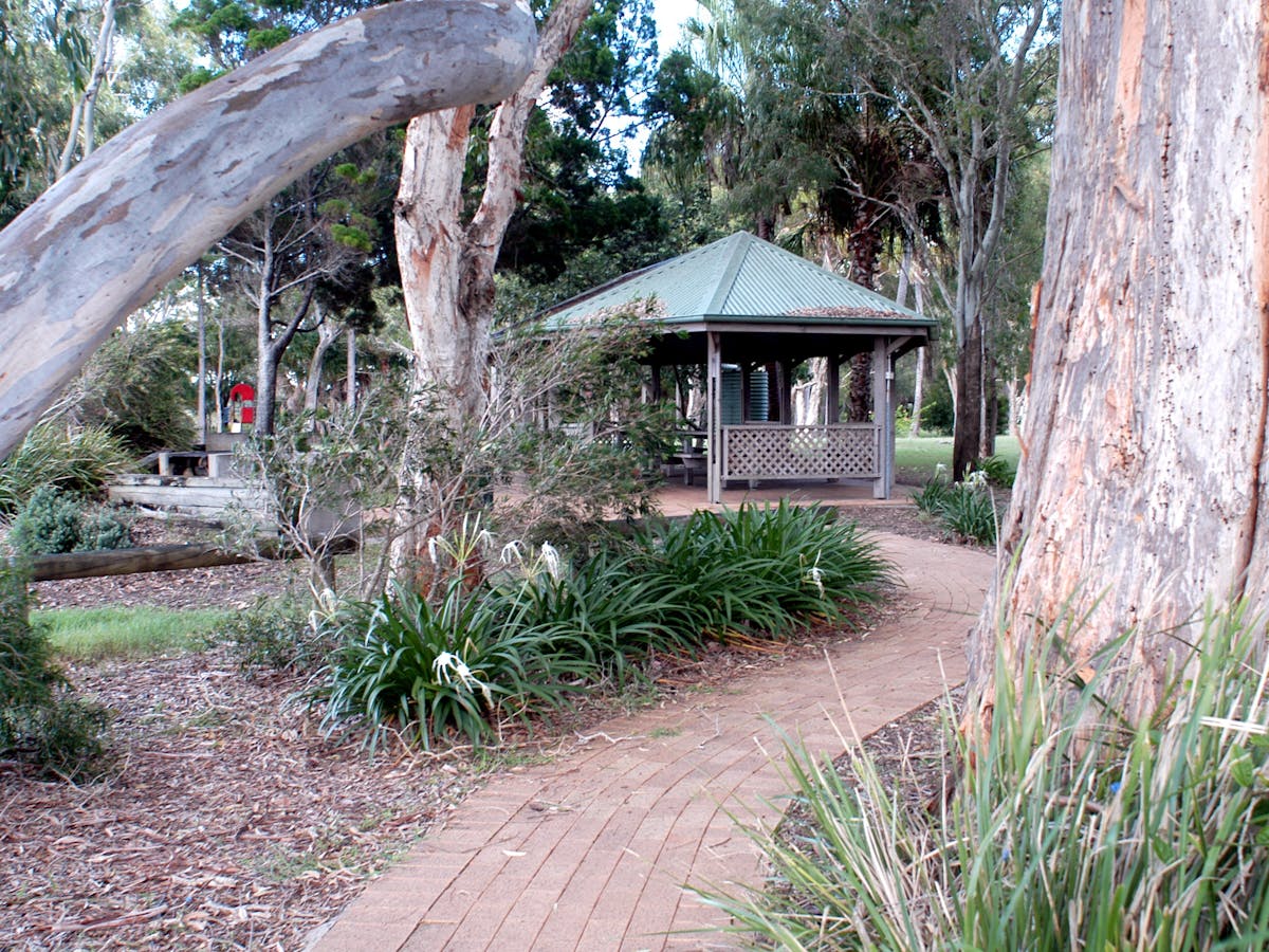 photo showing a smallpath leading to a BBQ shelter in a park at Poona on the Great Sandy Strait