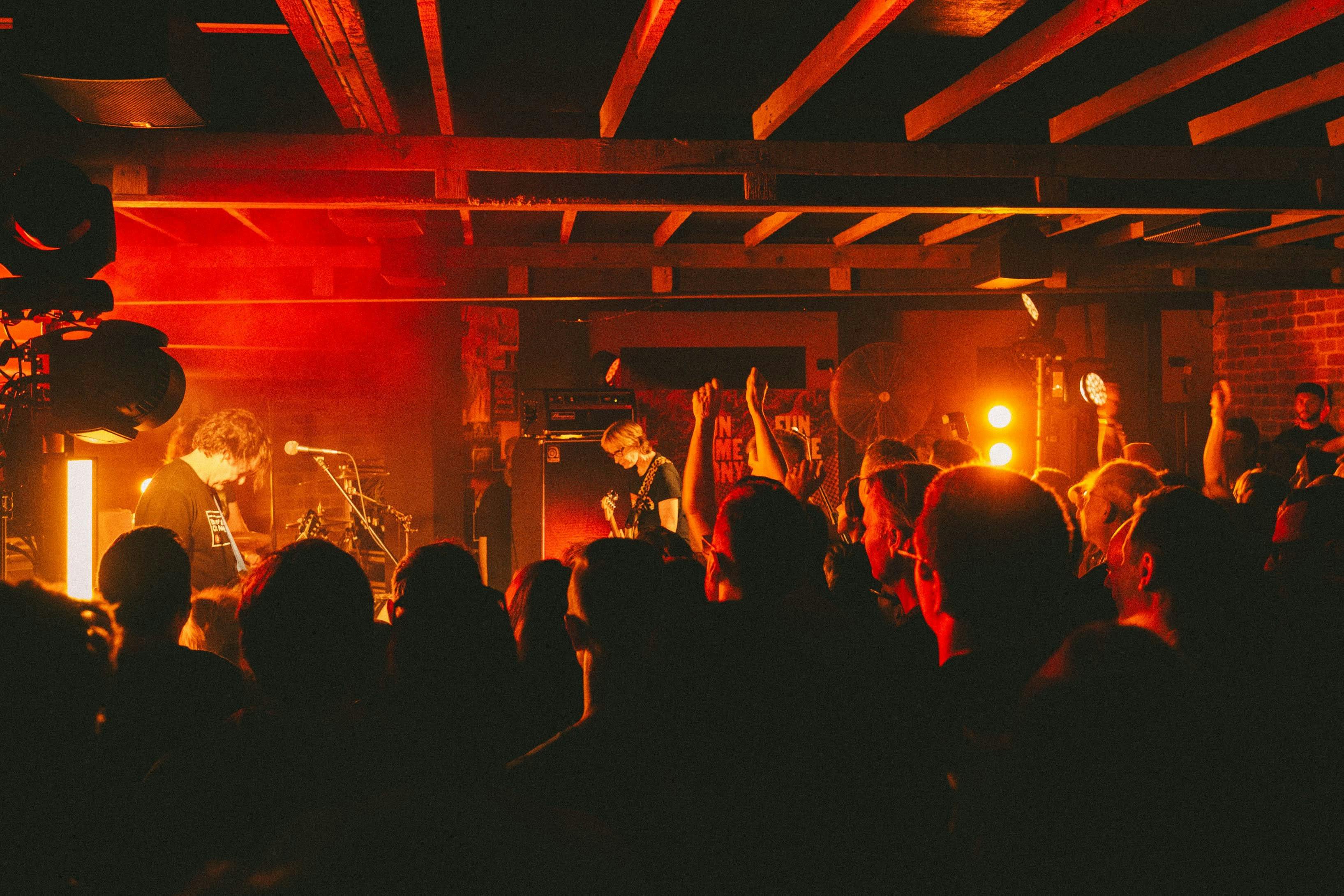Photo of bank on stage and crowd in foreground