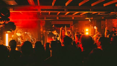 Photo of bank on stage and crowd in foreground