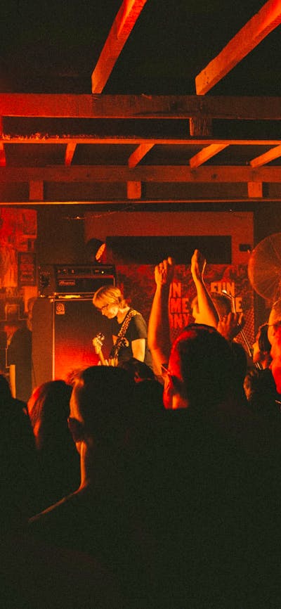 Photo of bank on stage and crowd in foreground