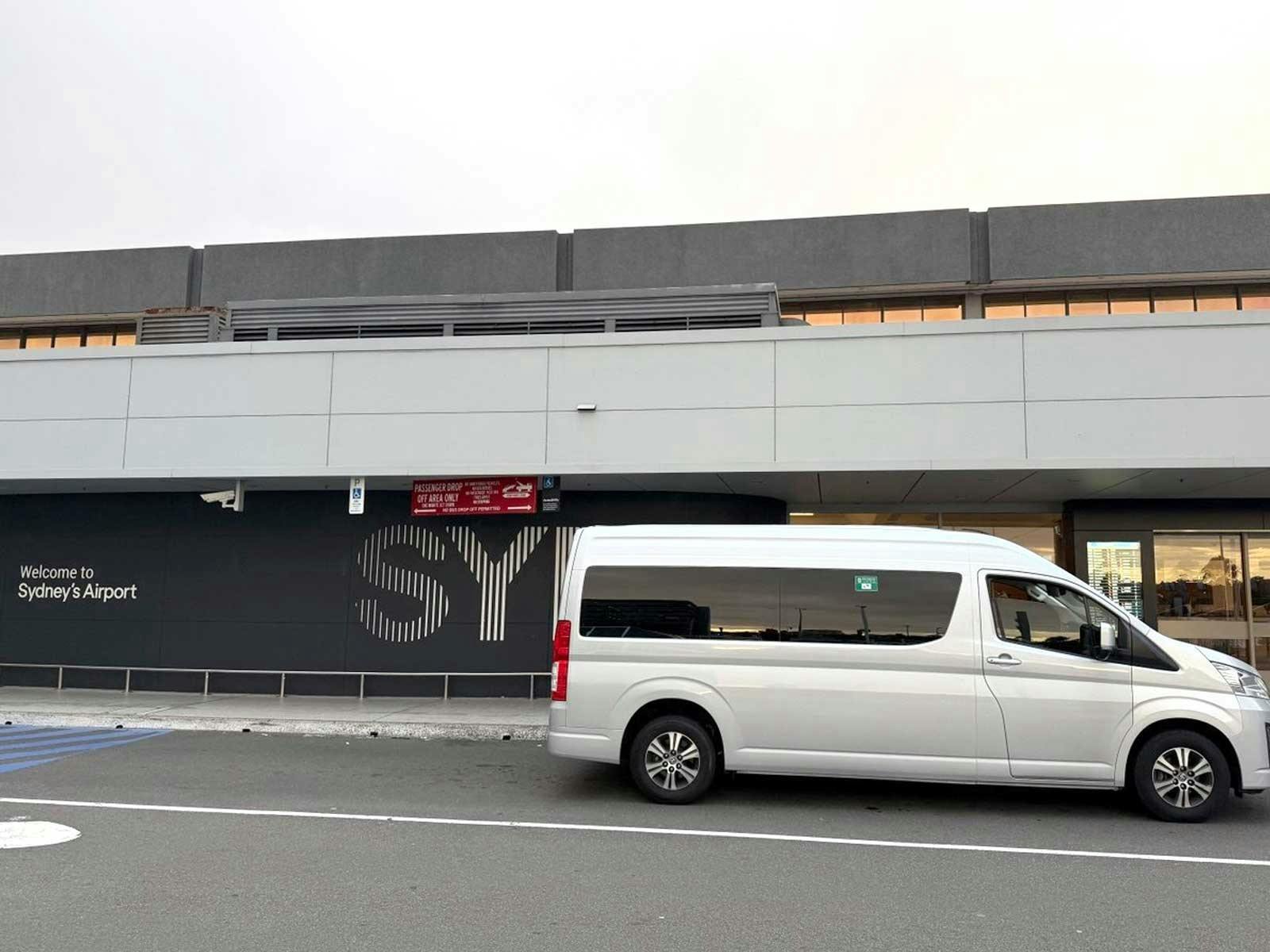 Toyota HiAce maxi taxi at the passenger pickup area at Sydney Airport