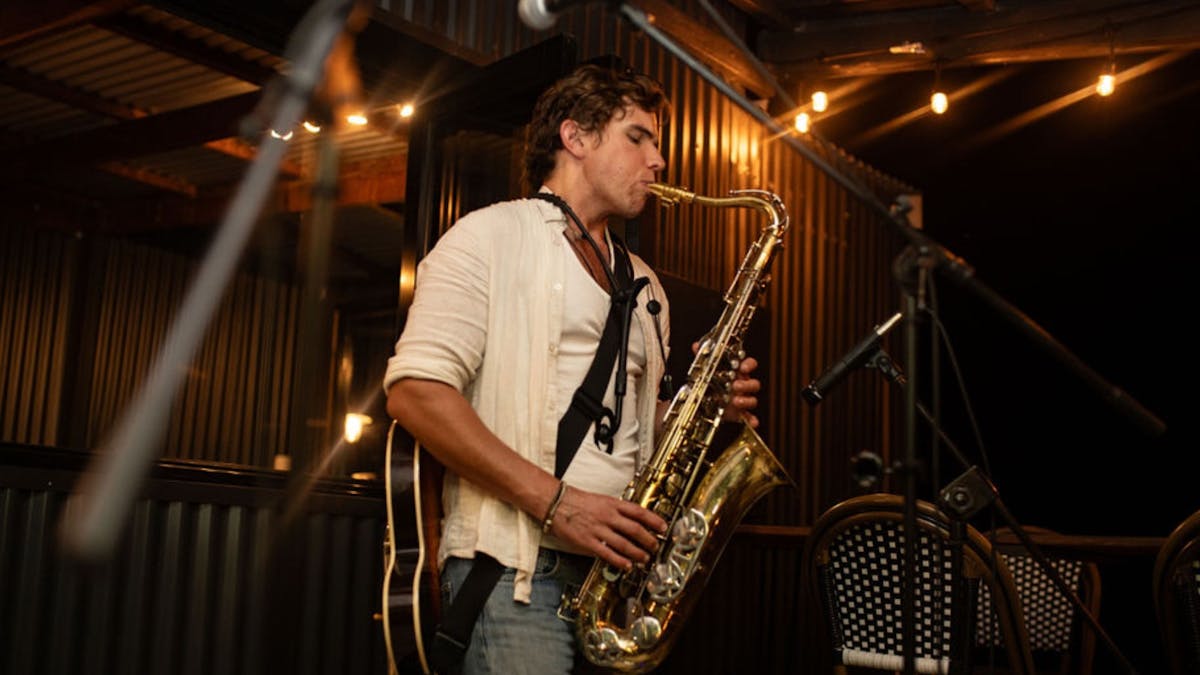 Evan Ayres on the saxapohone at Balancing Heart Vineyard on the Granite Belt, South-East Queensland