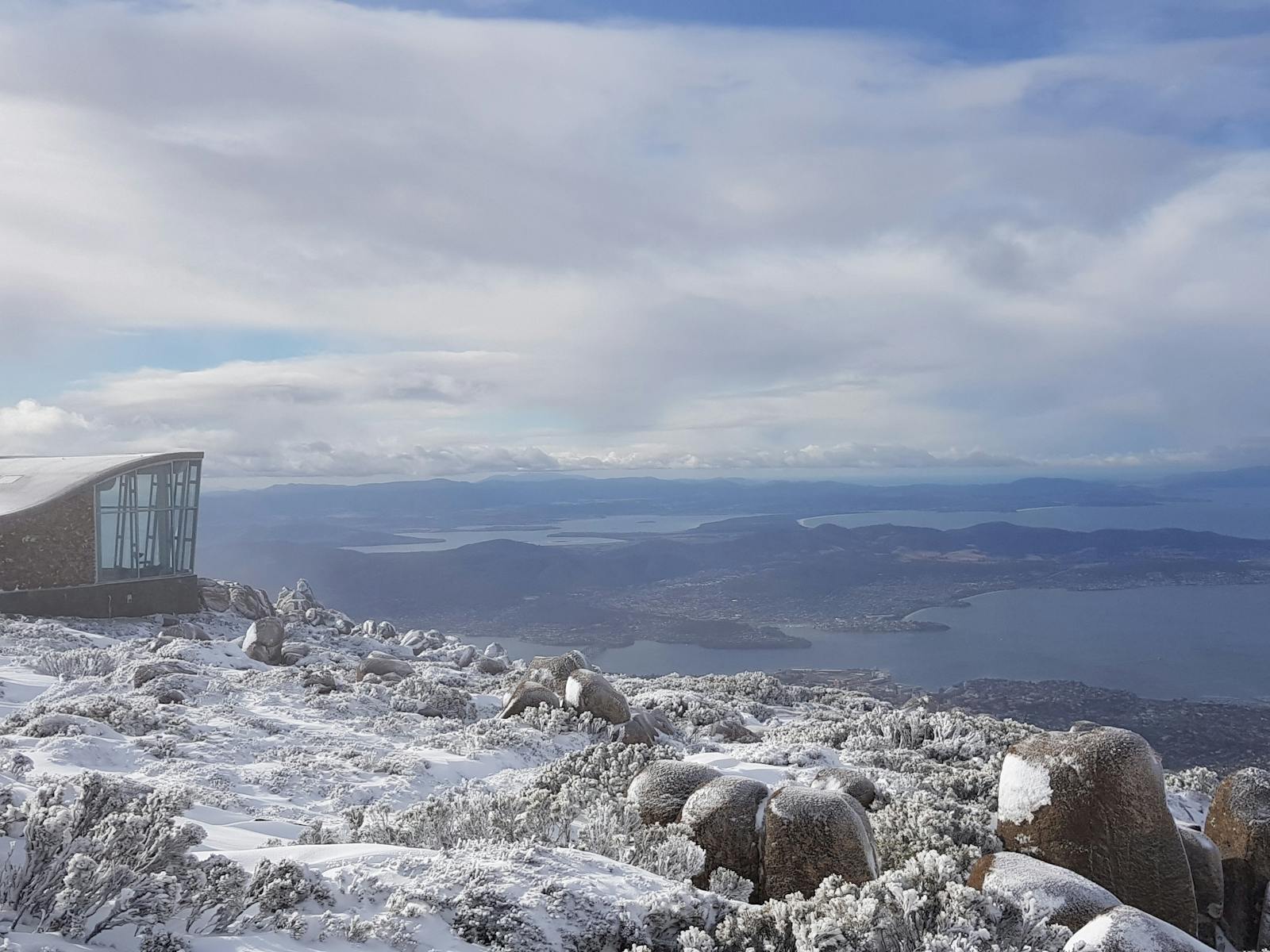 The summit of kunanyi/Mt Wellington covered in snow.