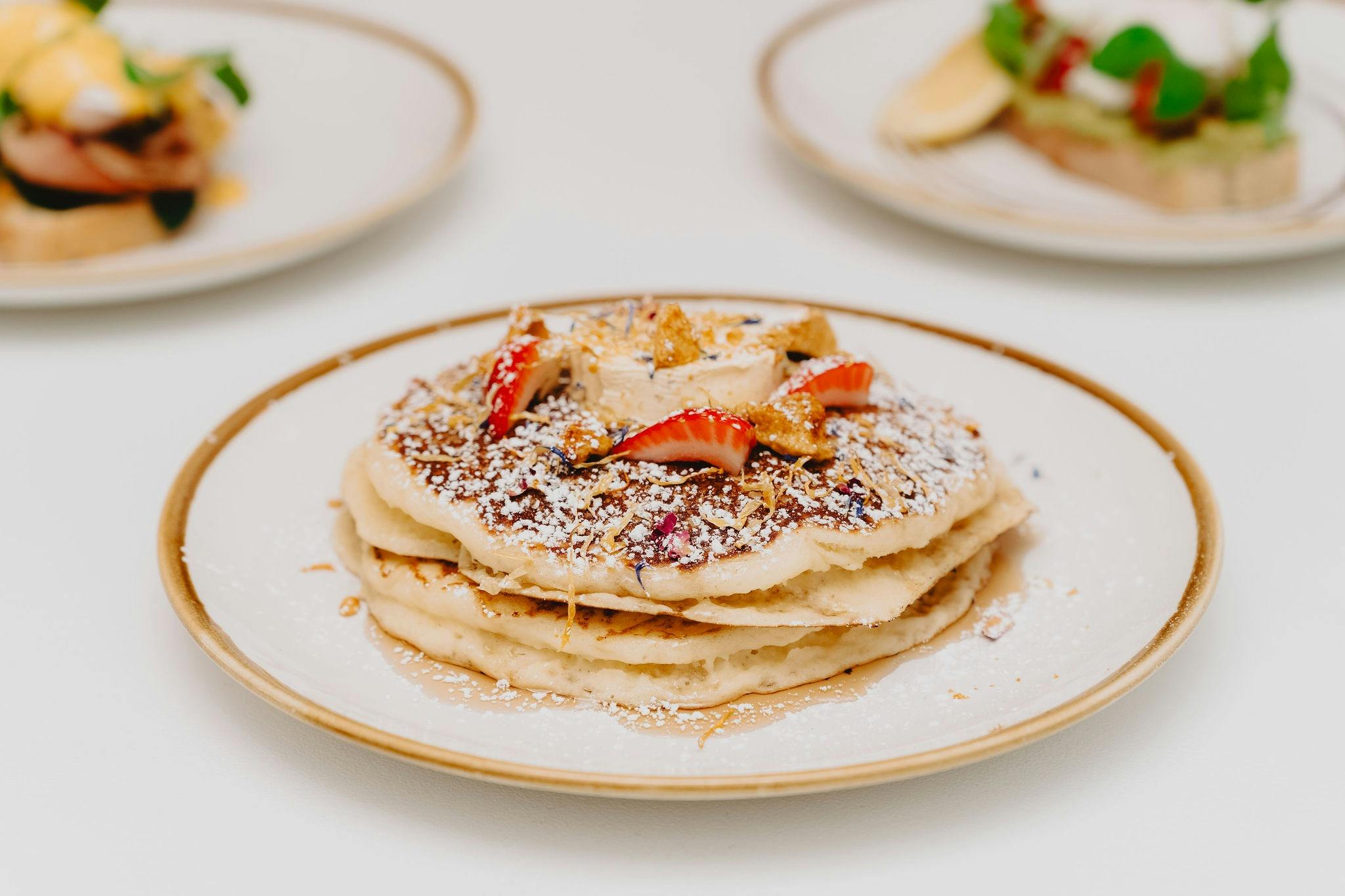 Pancakes with Strawberries and Icing Sugar
