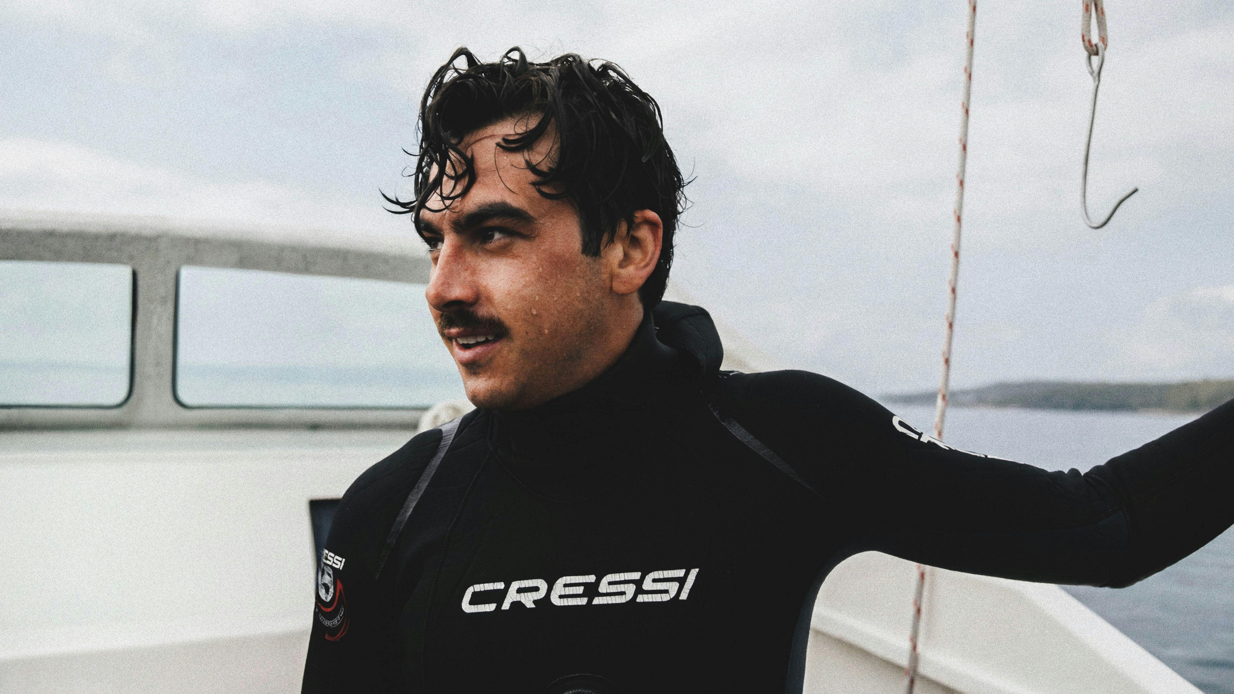 Still image of sea urchin diver Denzel Carriage on Yuin Country, from ‘Overflow’ film, 2026