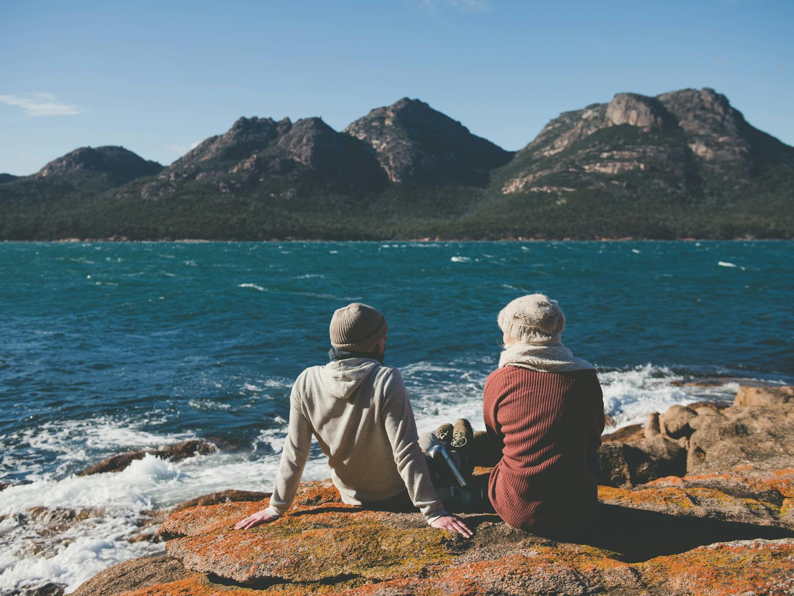 Couple enjoying incredible views at Coles Bay, Freycinet