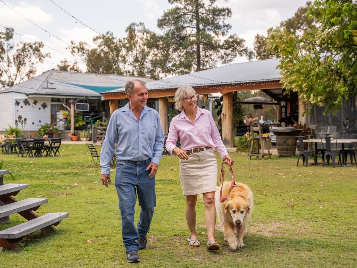 Couple walking with their dog at the Greenup Meeting Place Inglewood