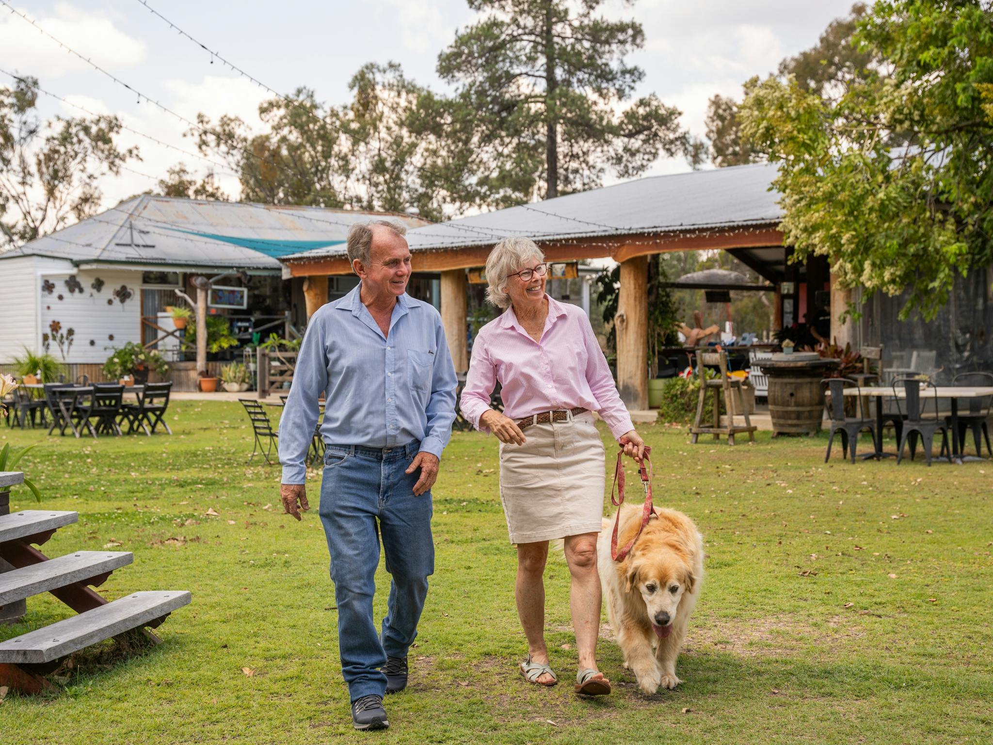 Couple walking with their dog at the Greenup Meeting Place Inglewood Couple walking with their dog at the Greenup Meeting Place Inglewood