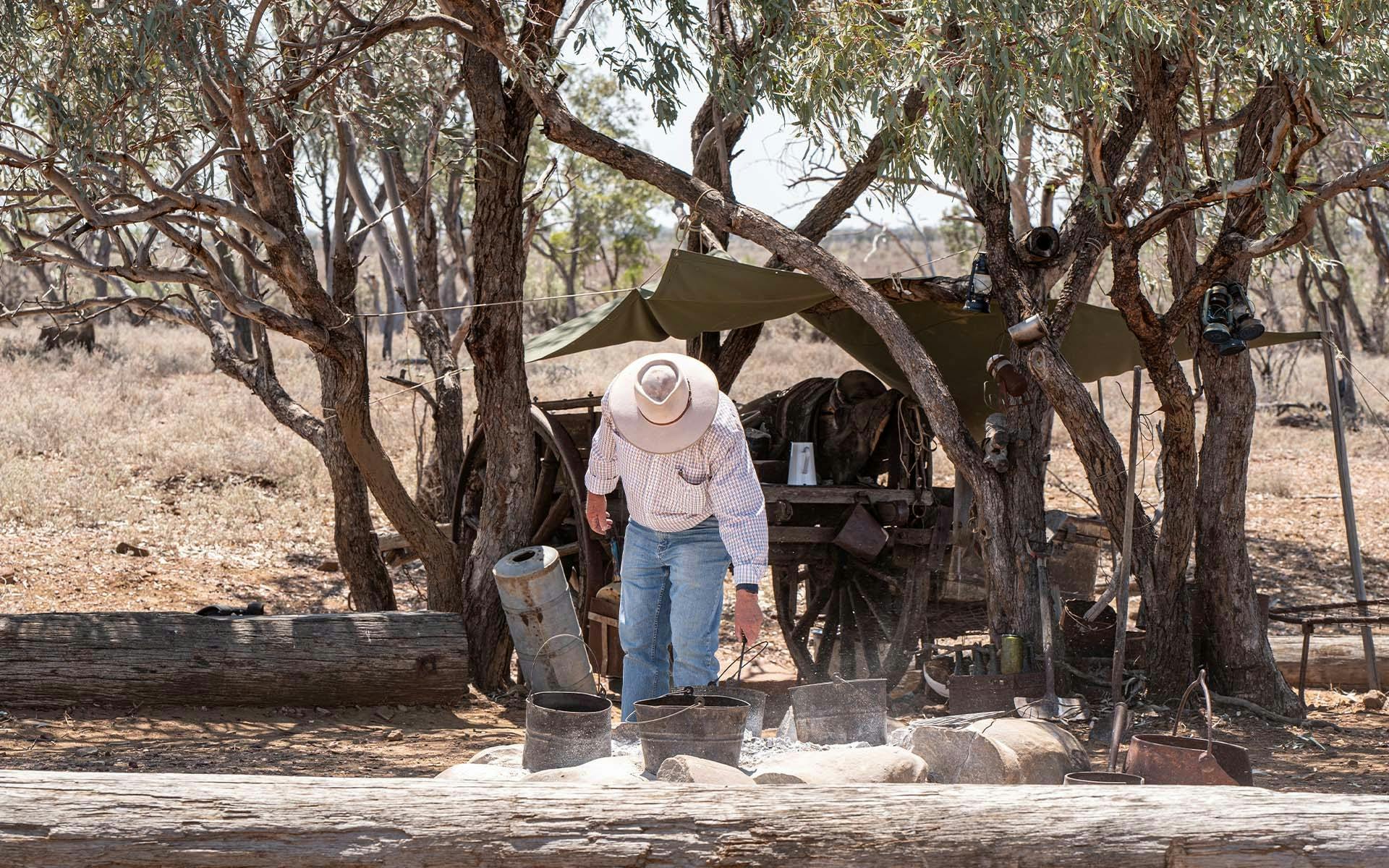 A stockman boiling a billy tea