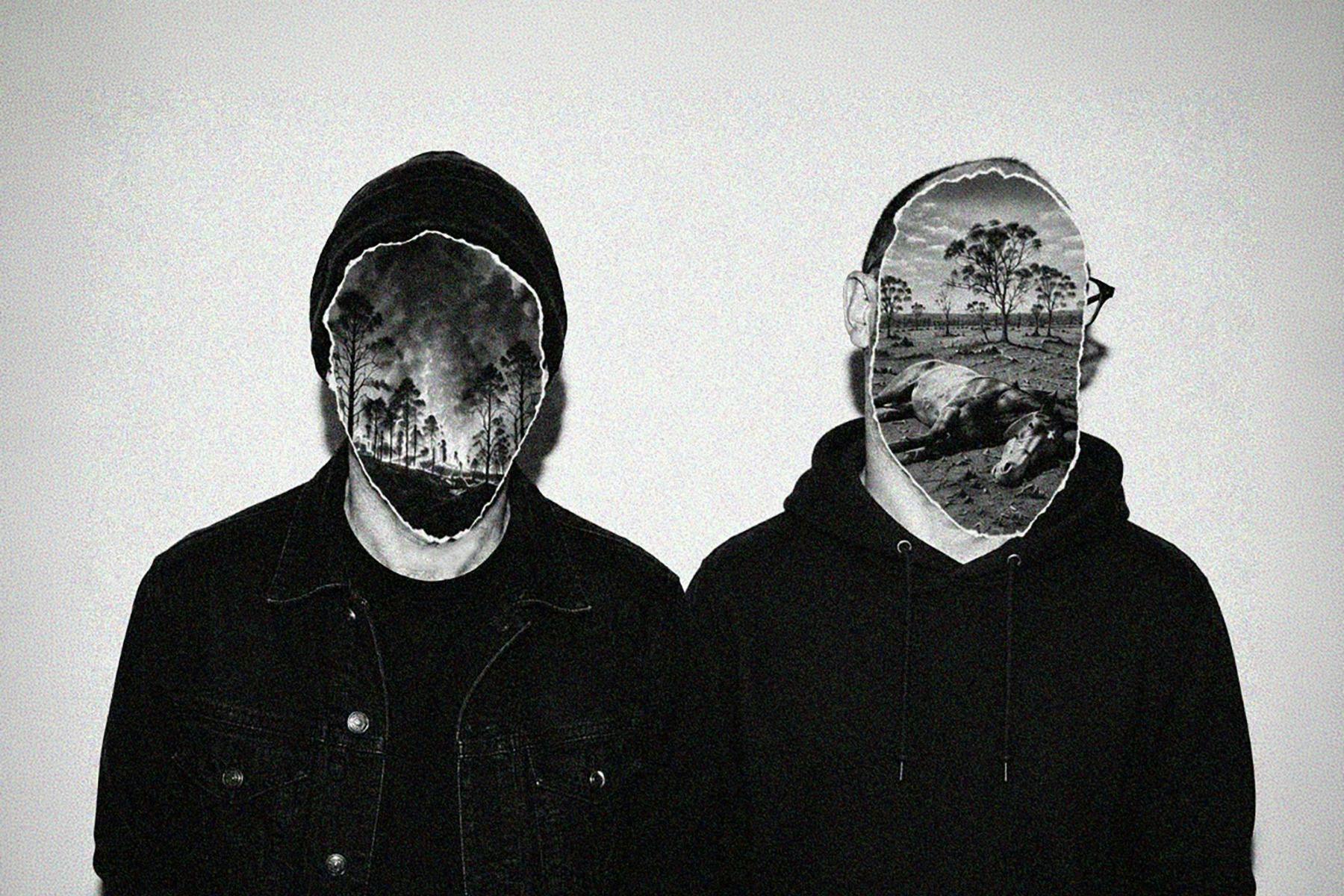 Two men with faces covered by landscape photos