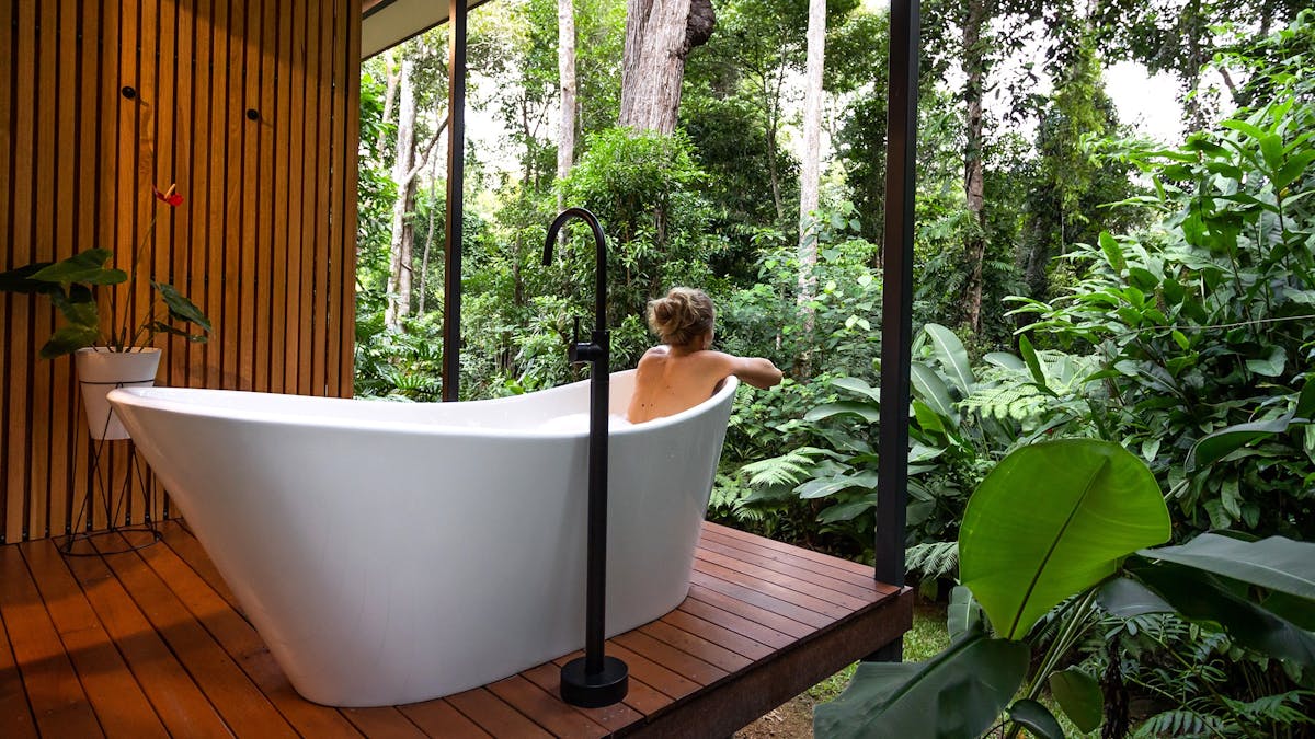 Guest enjoying the Spring Haven Kuranda bath with a view