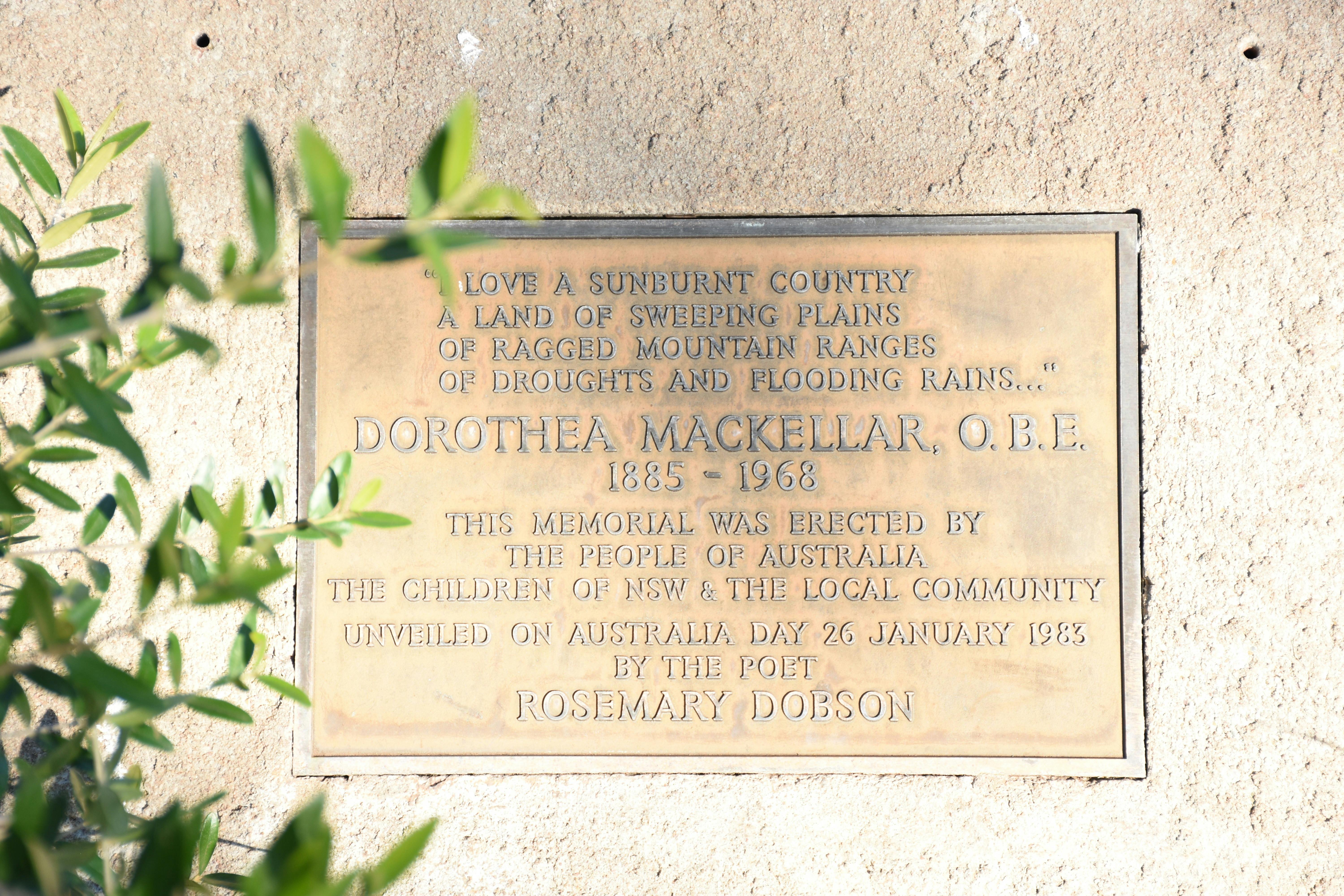 Close-up of the Plaque with some green leaves on left-hand side