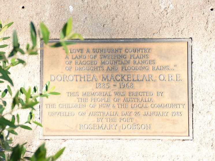 Close-up of the Plaque with some green leaves on left-hand side