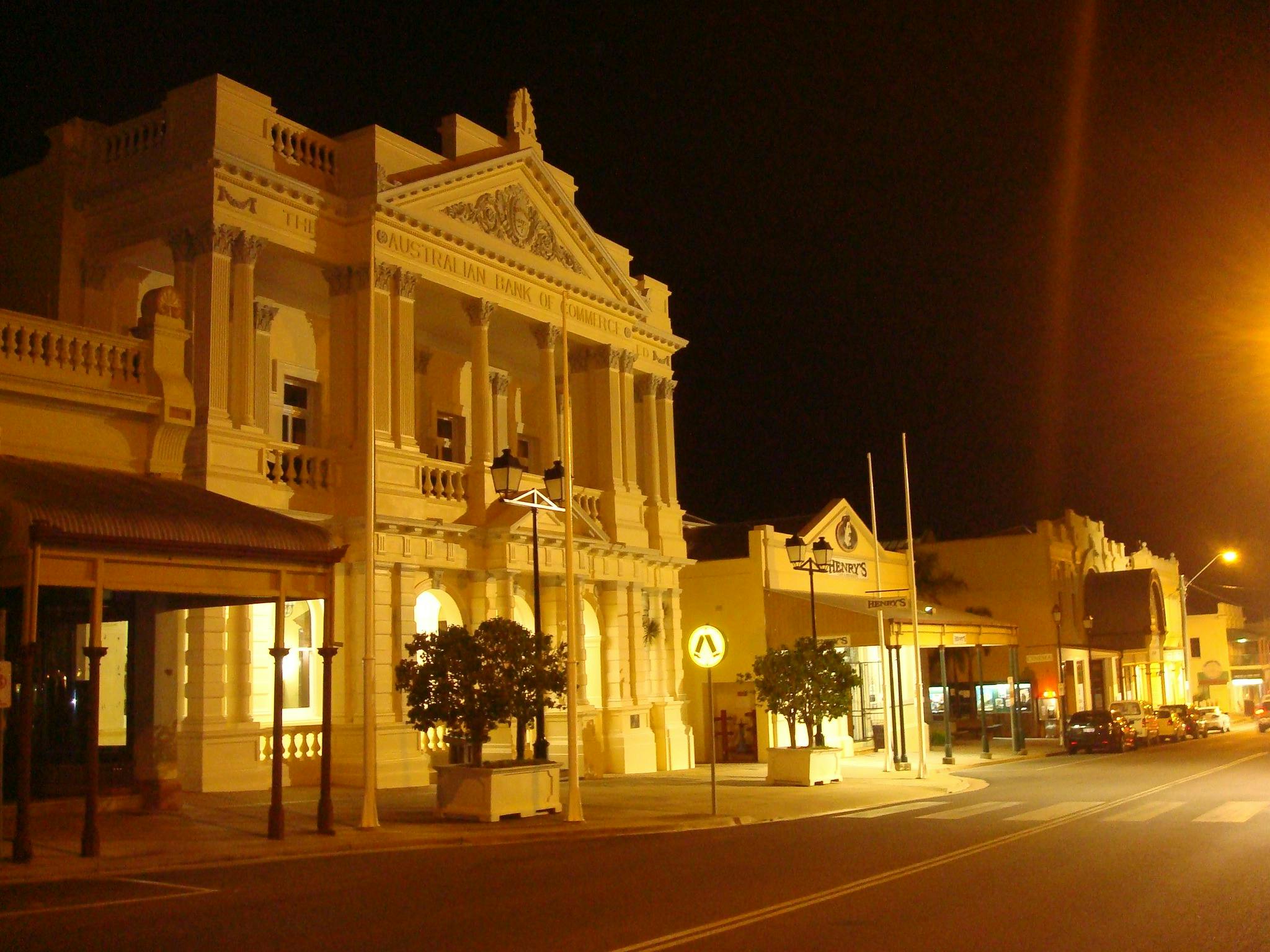 stock exchange building at night lit by streetlights