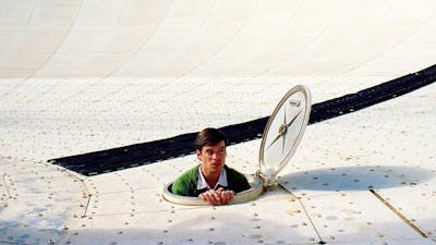 Man coming out from a satellite trap door