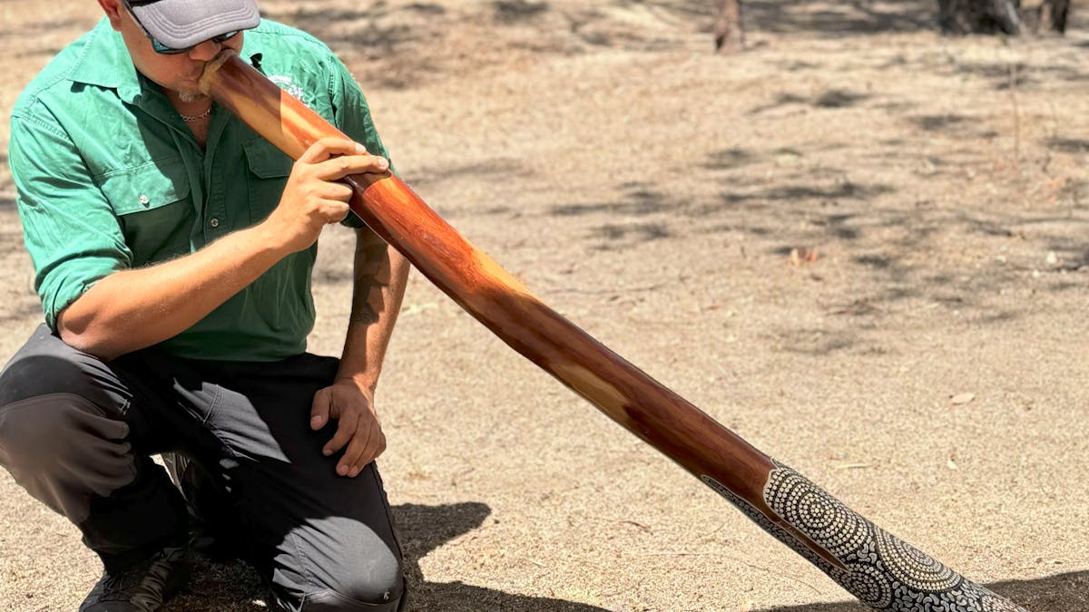 Guide plays didgeridoo