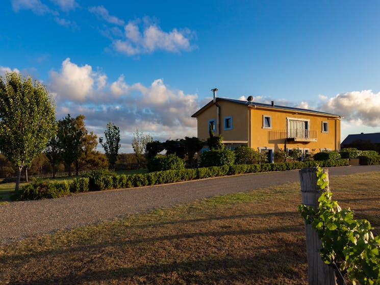 The yellow Tuscan villa on top of the hill