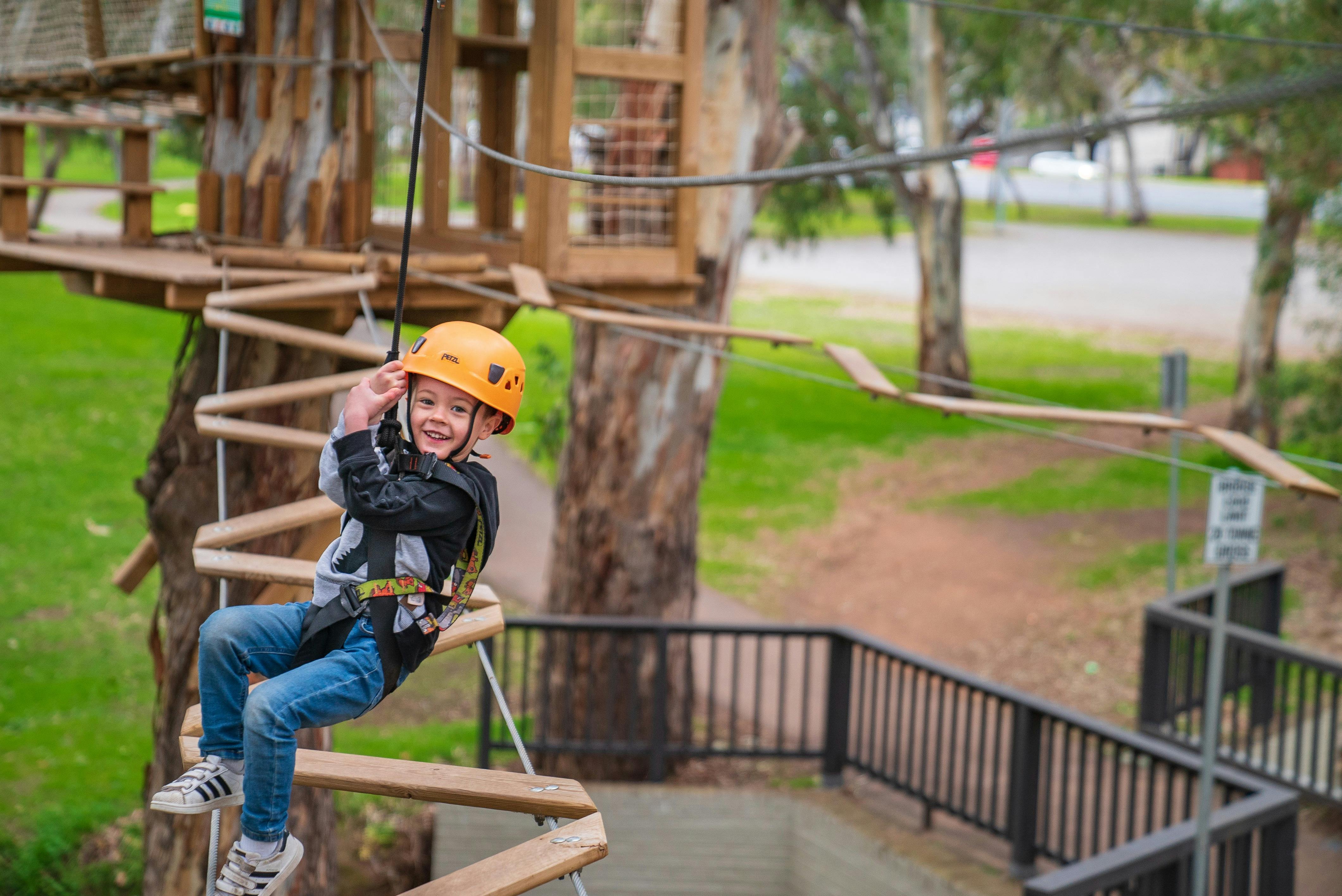 Child climbing at TreeClimb