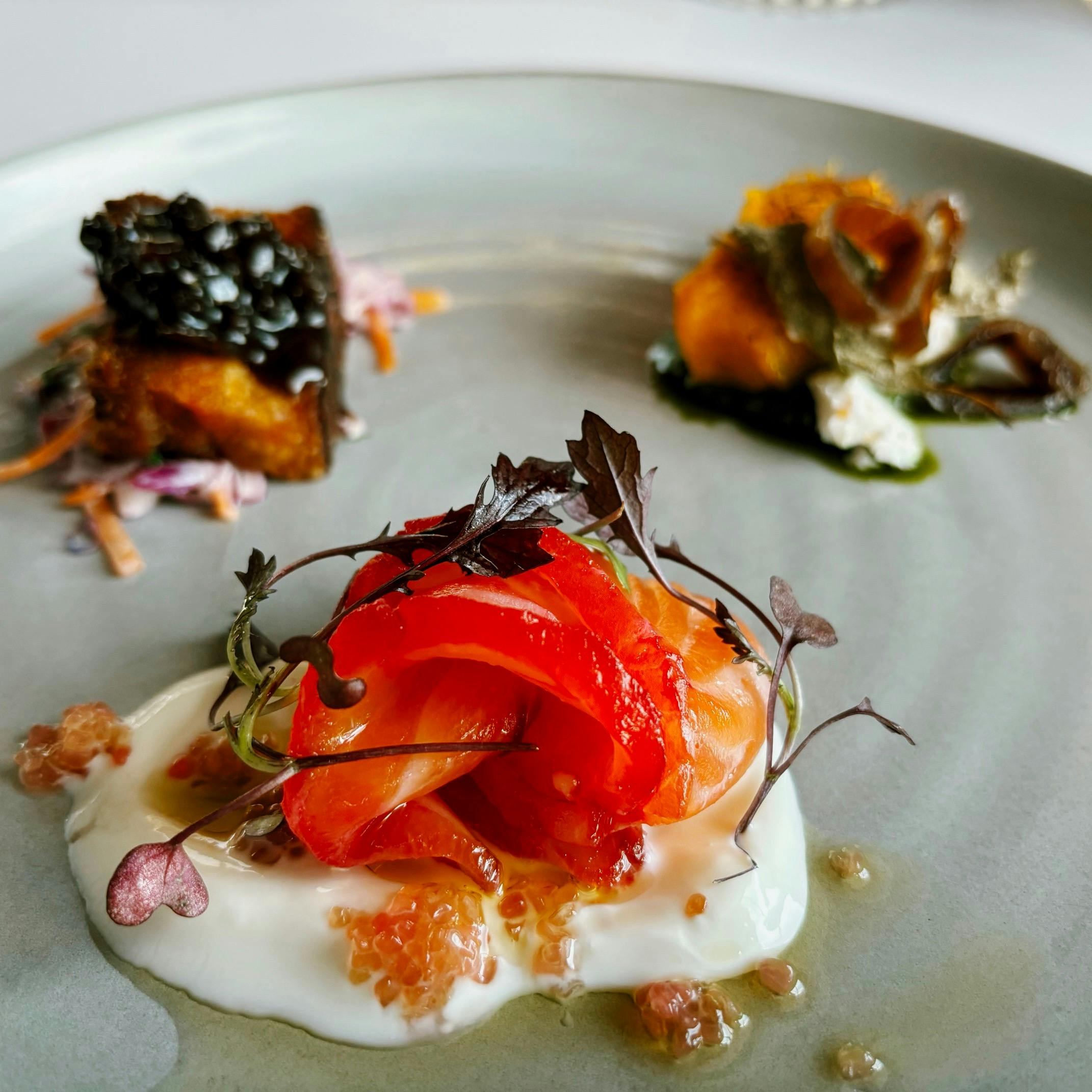 The Grill tasting plate, Aniseed myrtle pork belly, Beetroot cured salmon, Baked Pumpkin saltbush