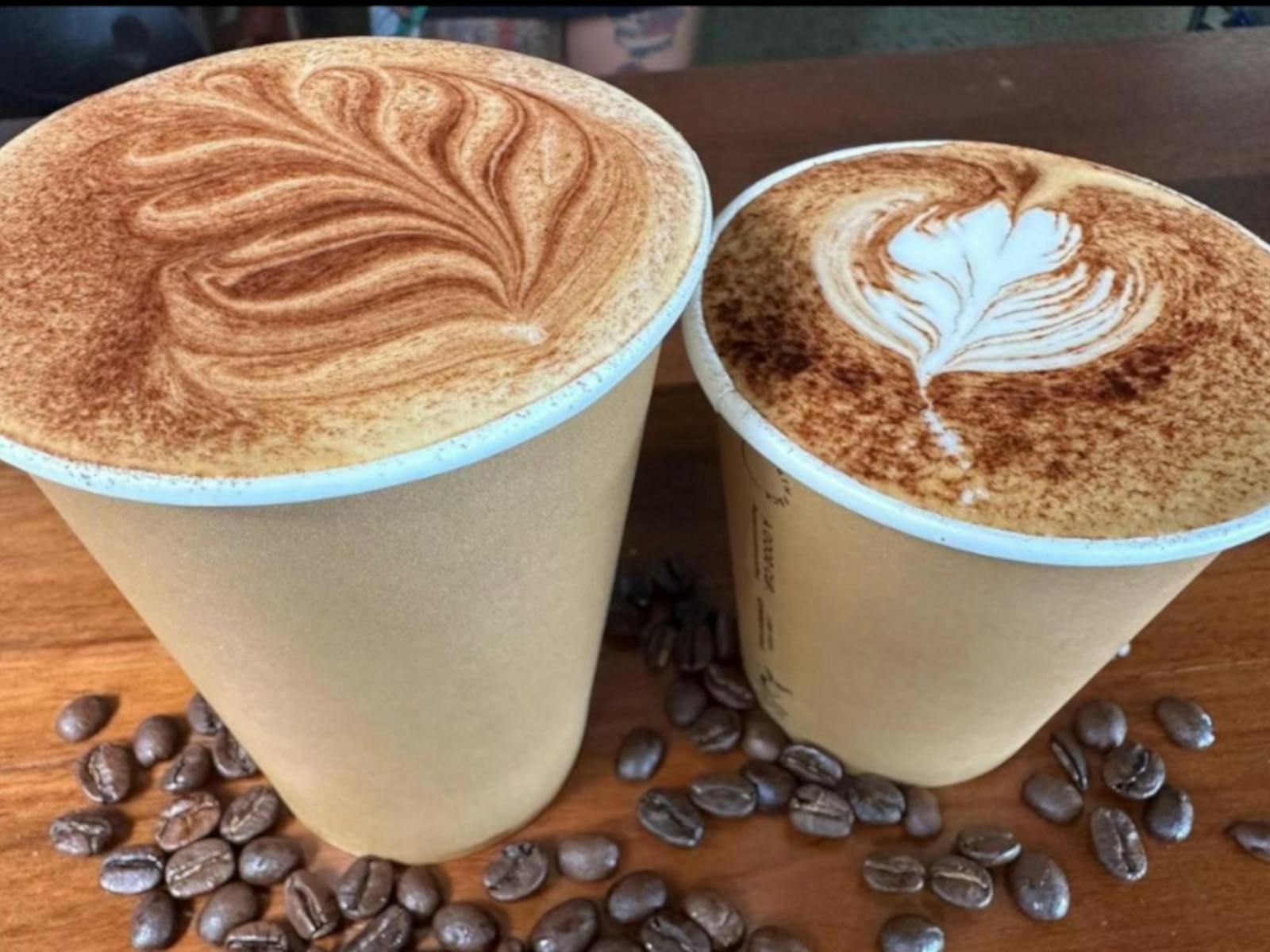 two delicious looking coffees in takeaway cups