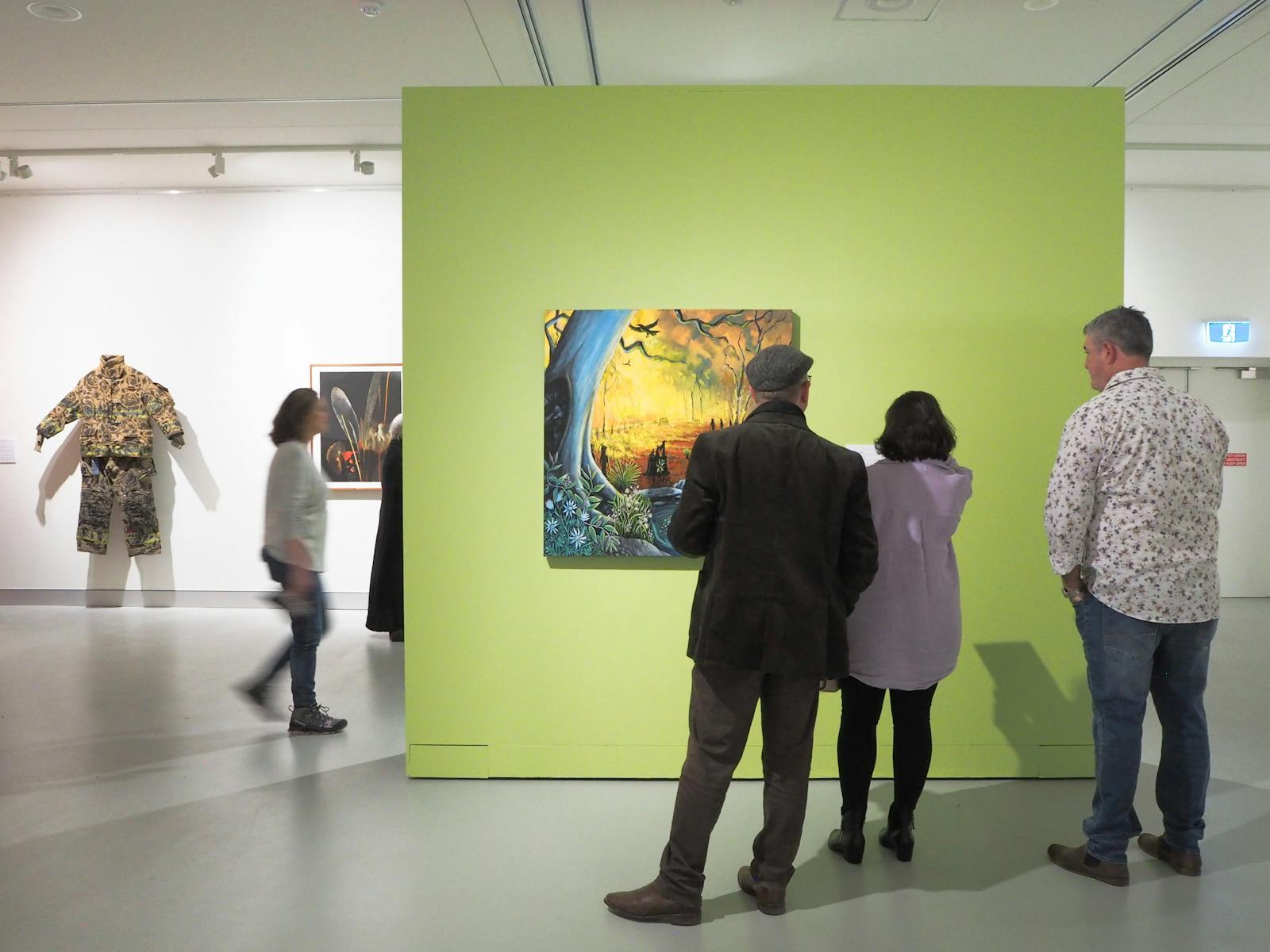 Visitors viewing an artwork