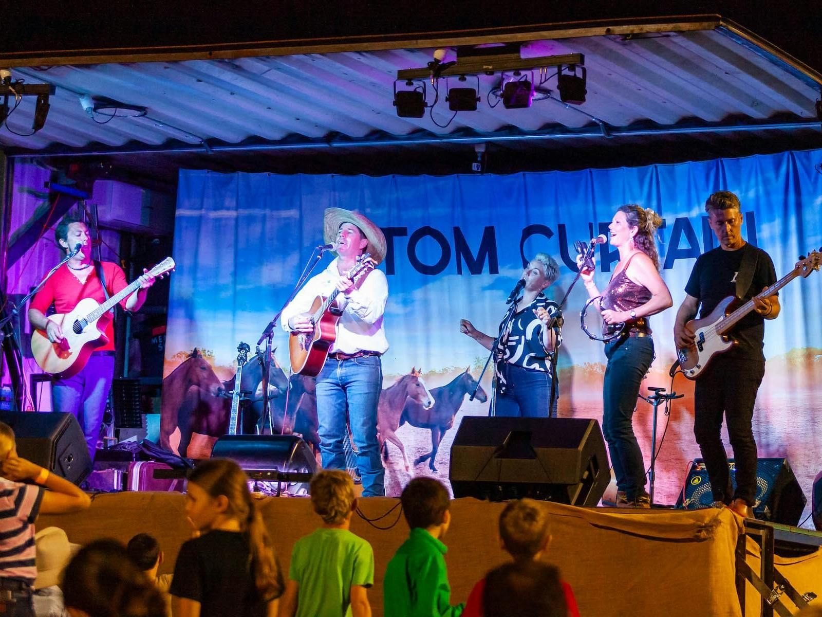Singer songwriter performing on stage
