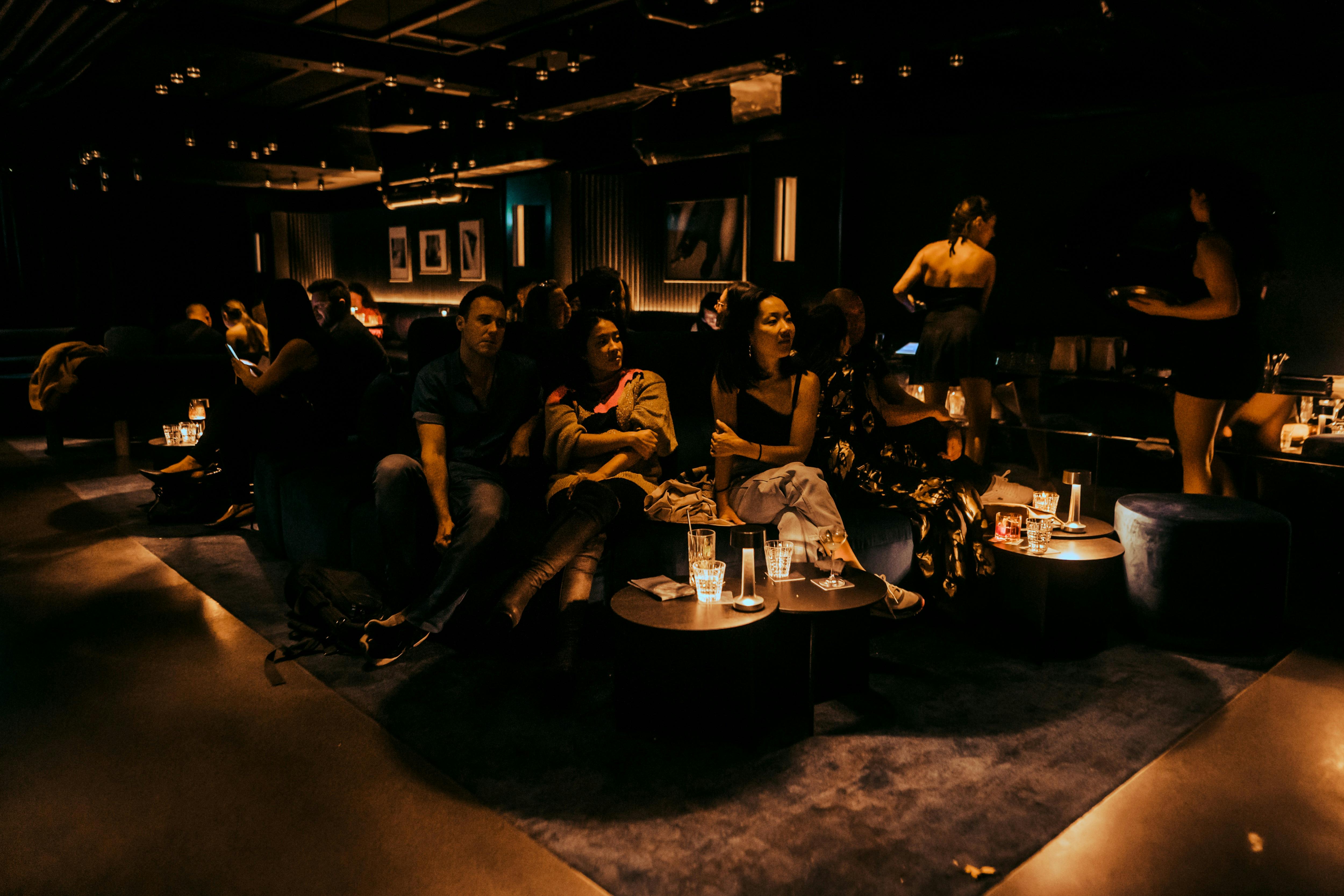 Group shot of people around the lounges at the venue