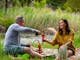 couple enjoying wine on a picnic during their ebike ride