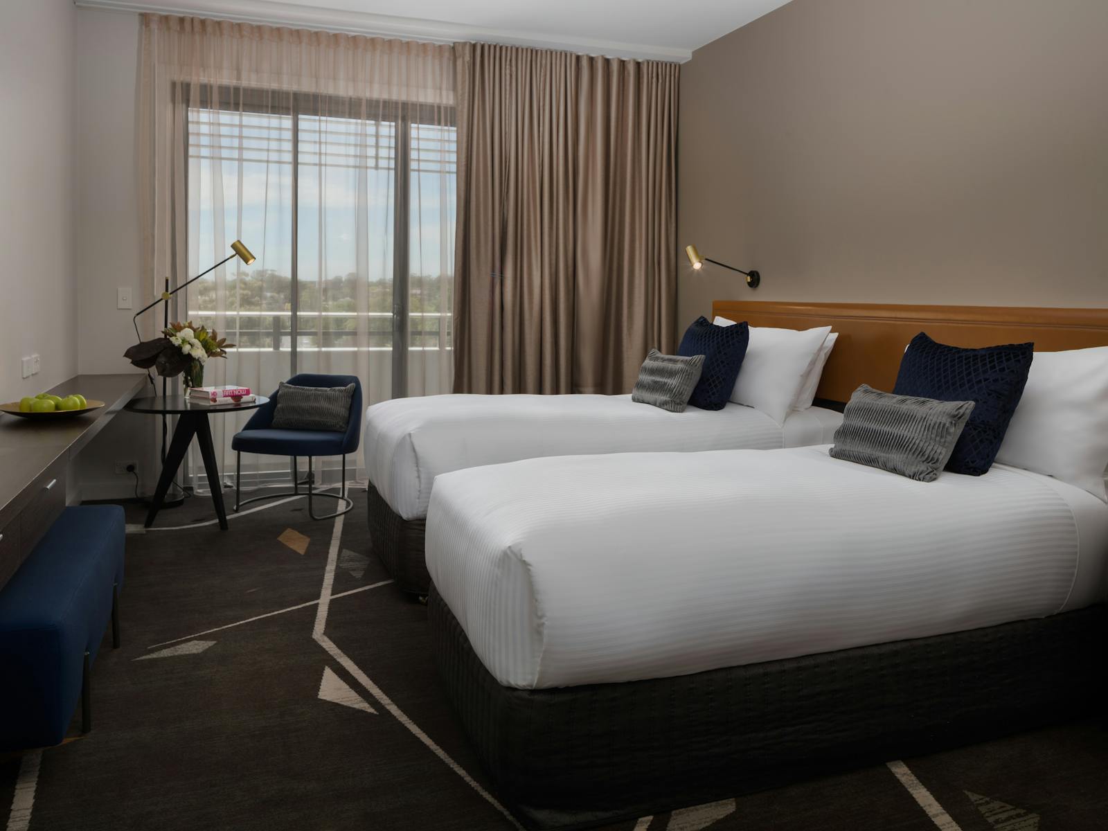 Hotel guest room with two king single beds