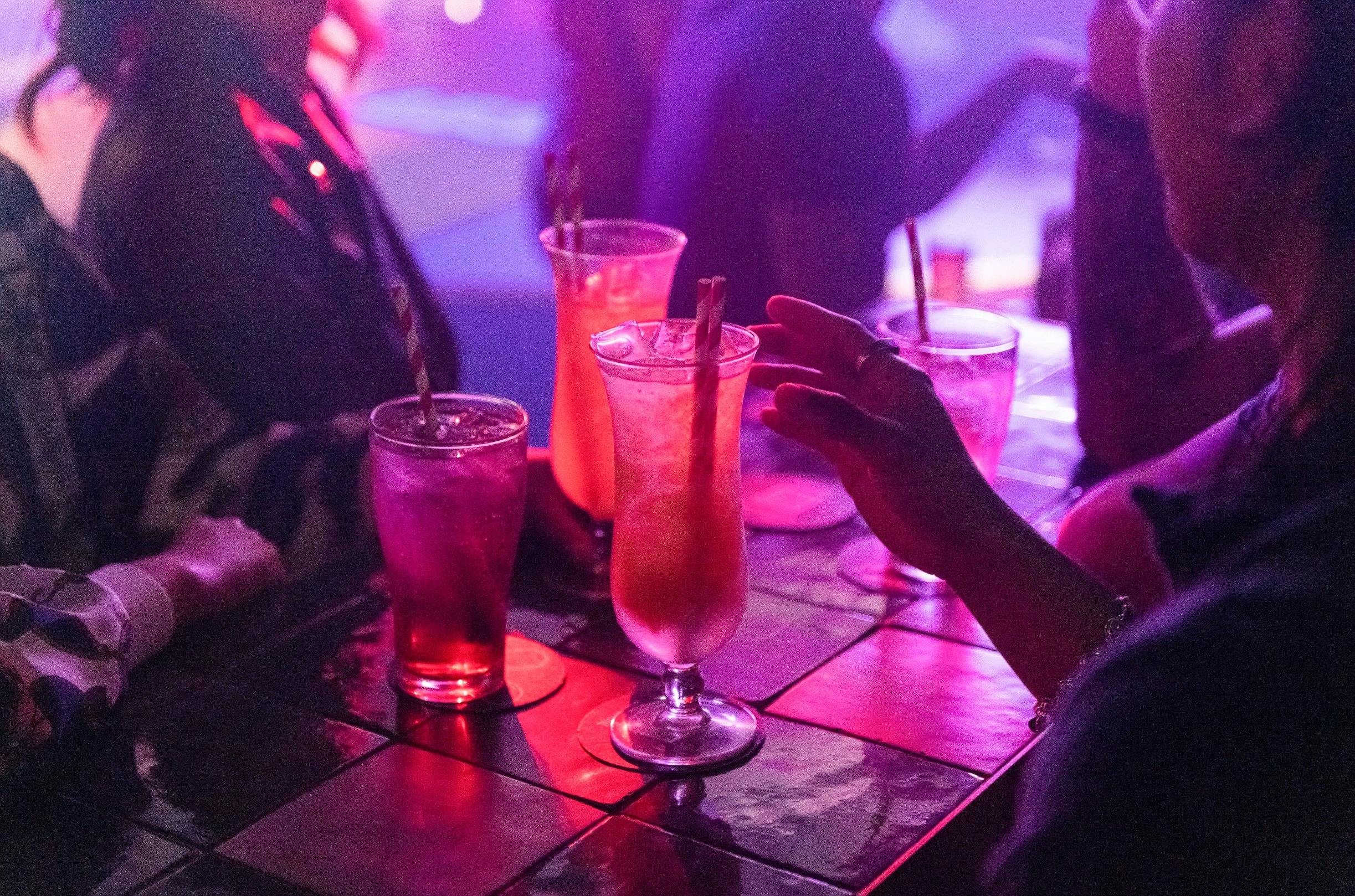 Friends enjoying drinks at Universal Sydney nightclub in Darlinghurst, Sydney