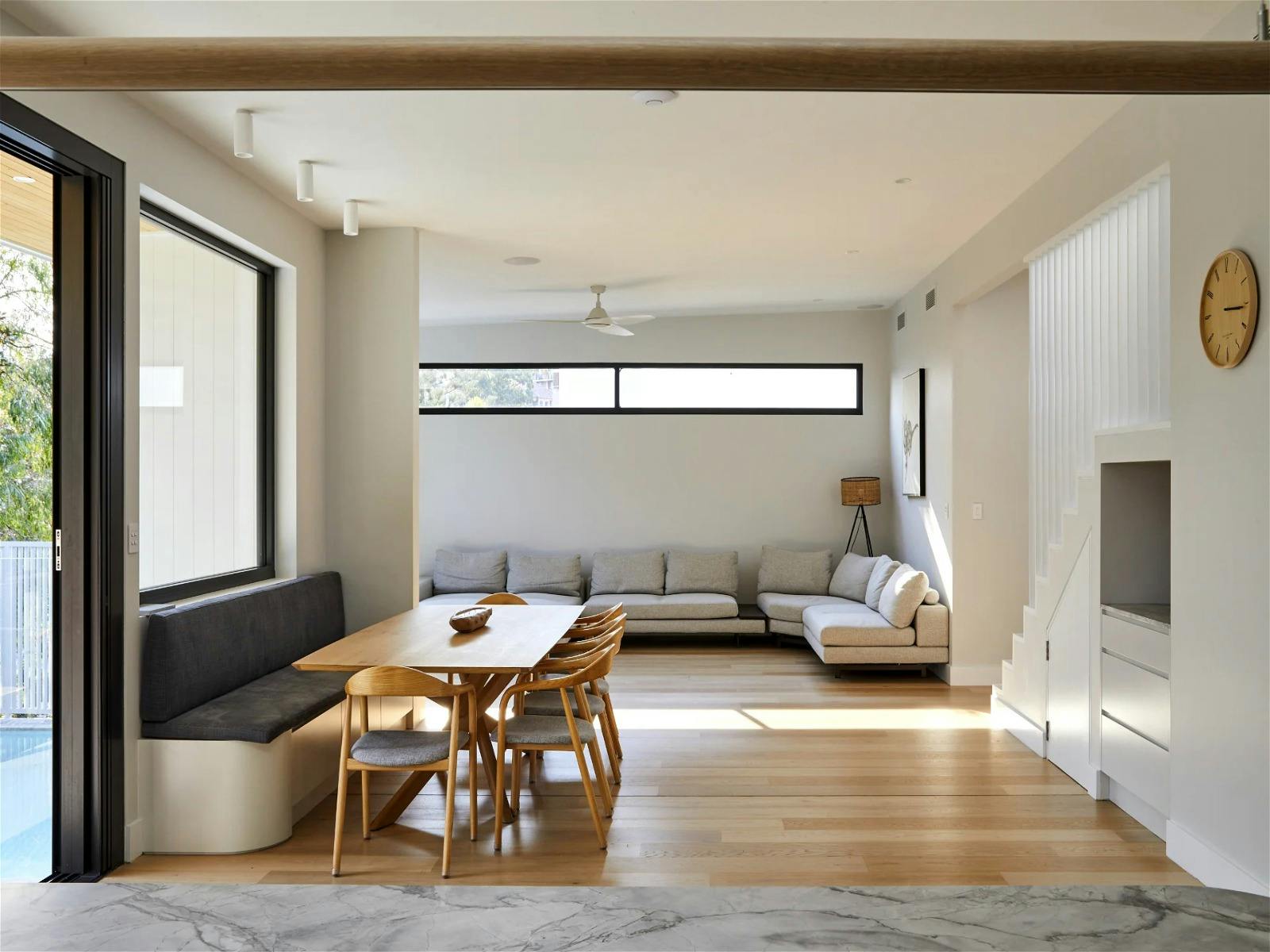 dining and living area that opens up to deck and garden