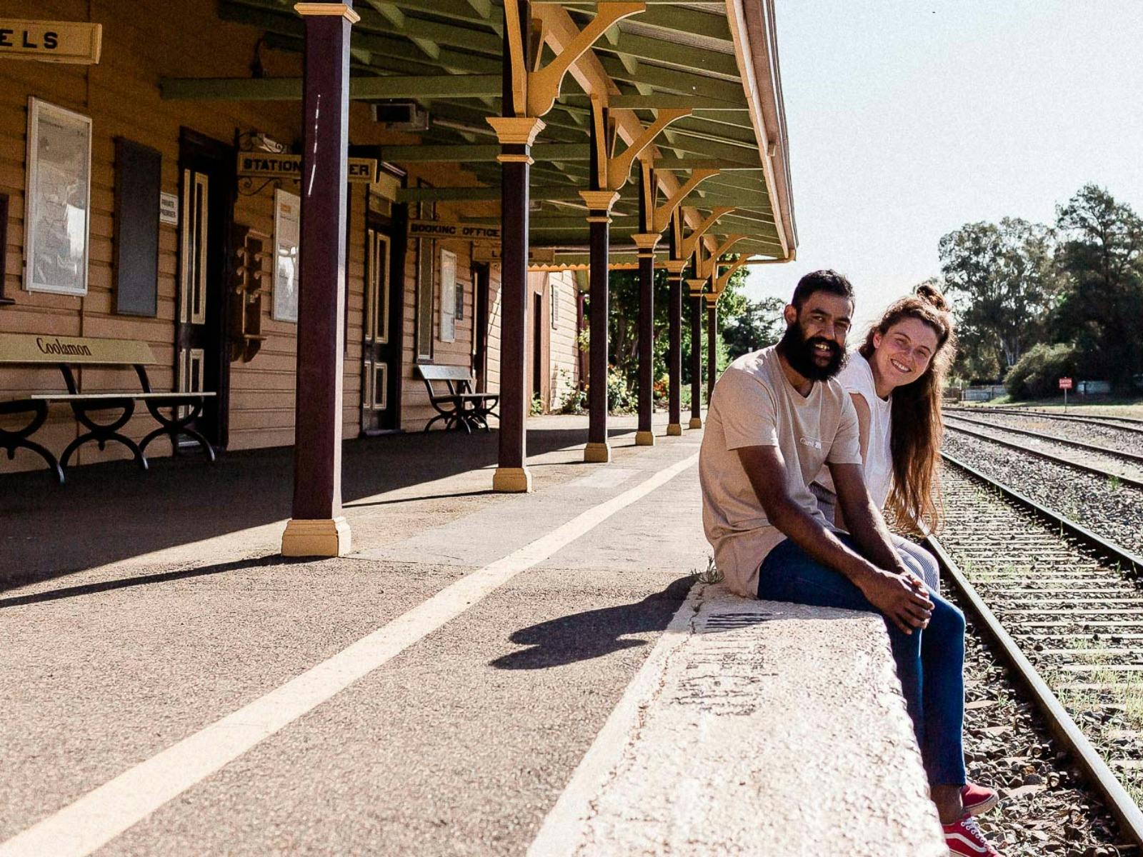 Cafe owners sitting on railway station platform