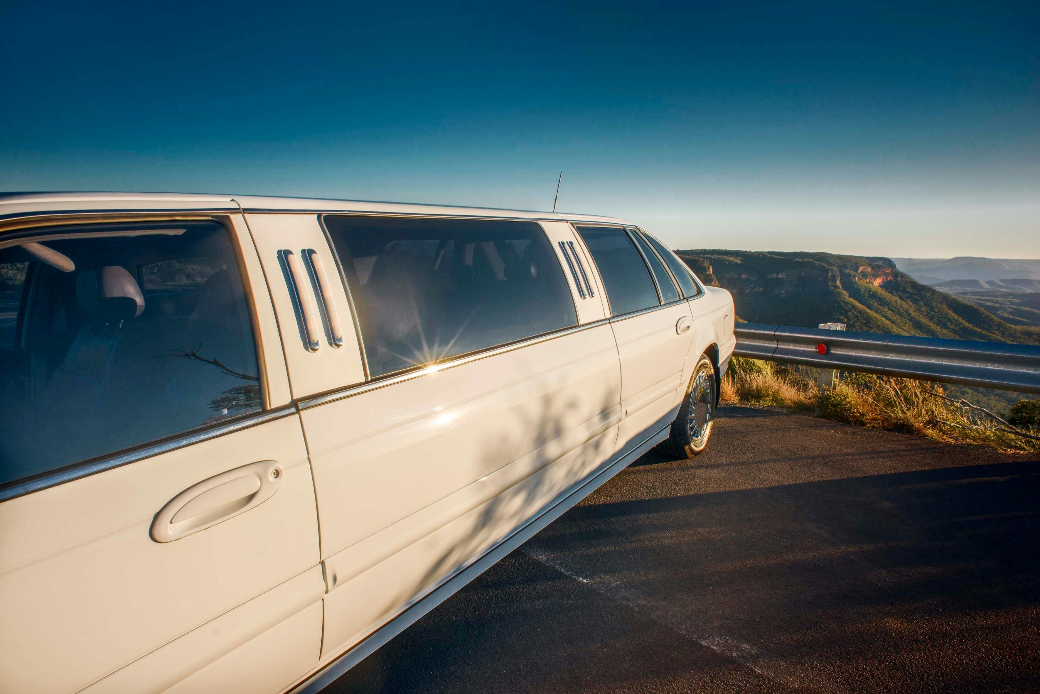 Stretch limousine in front of mountain view