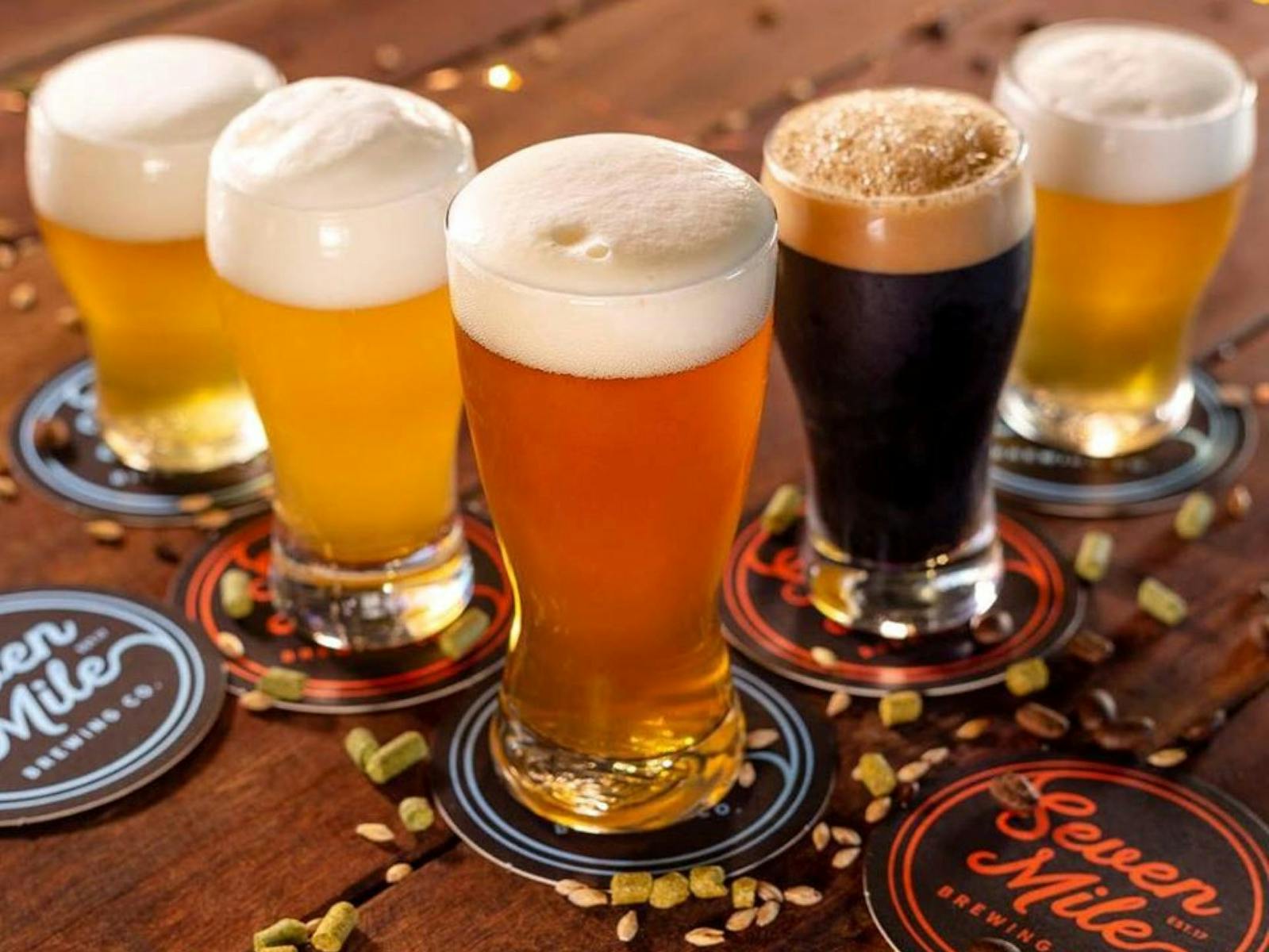 Five types of beers laid out on a table