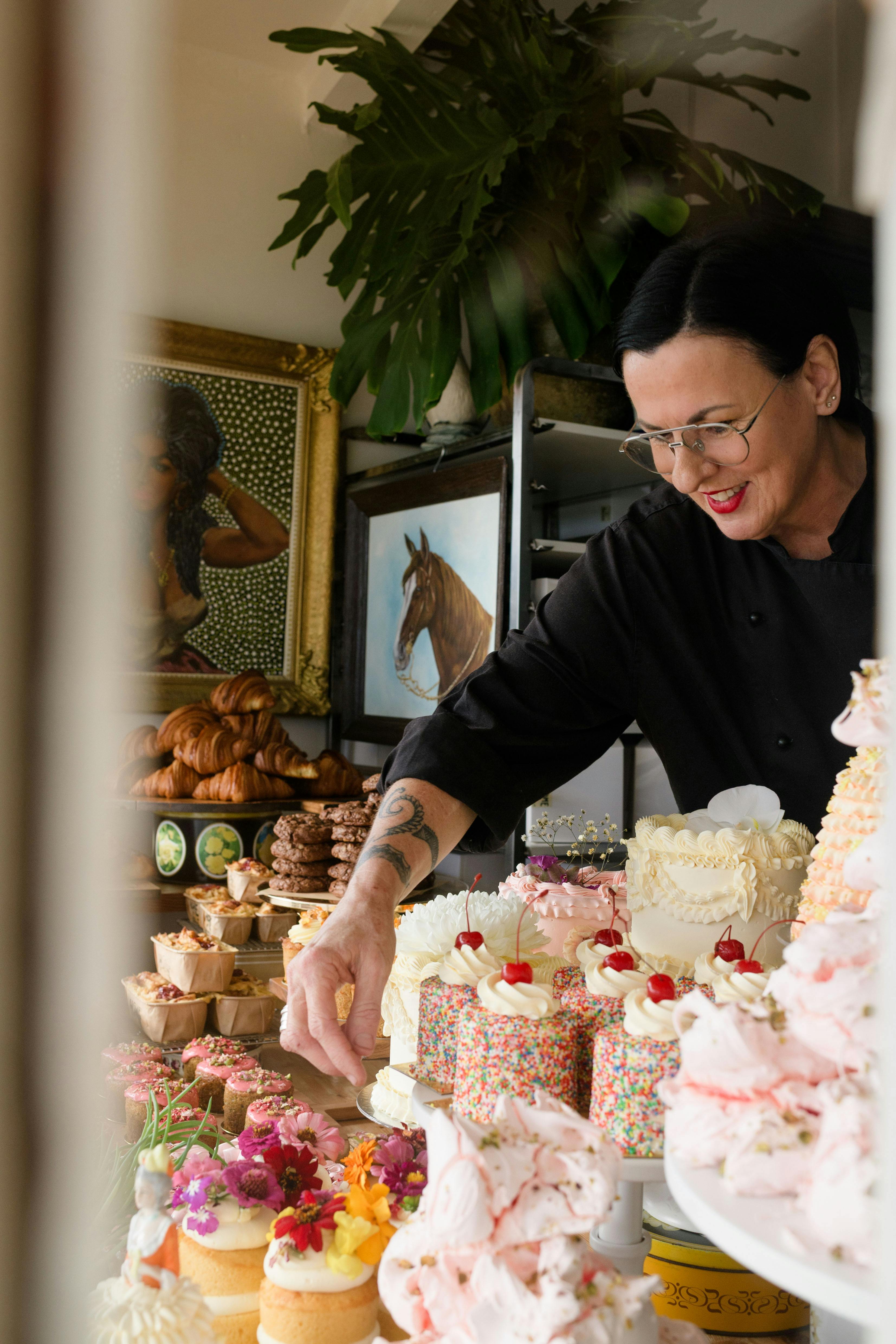 Cherie placing Cakes in the Window