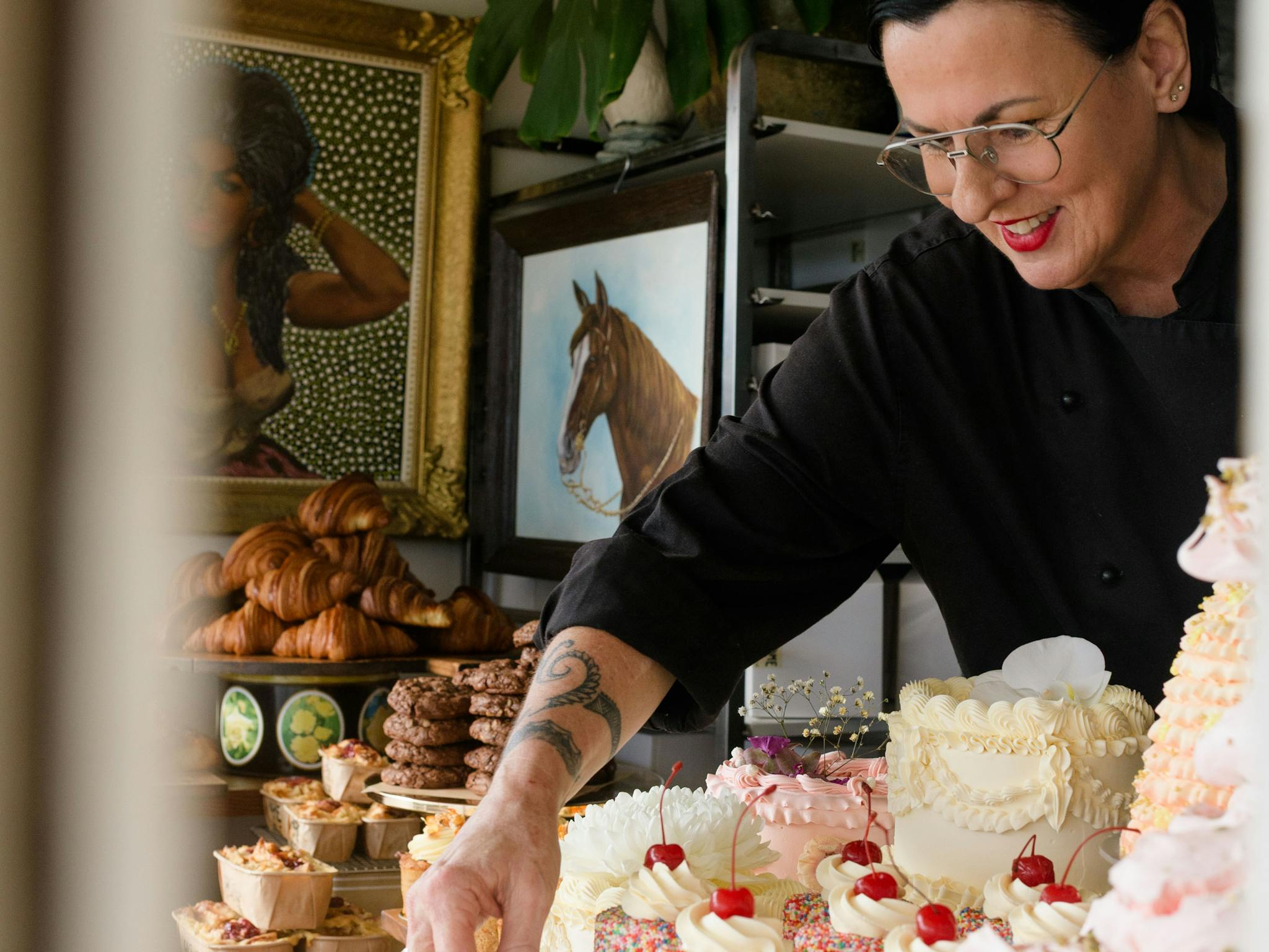 Cherie placing Cakes in the Window