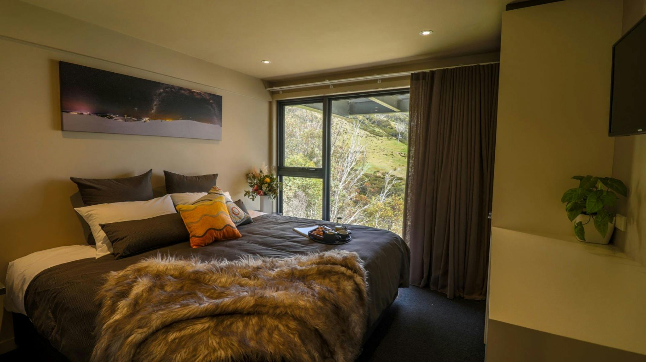 Bedroom with extra bed with view from large window