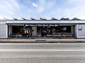 The front entrance of a pub built in the 1960s style.