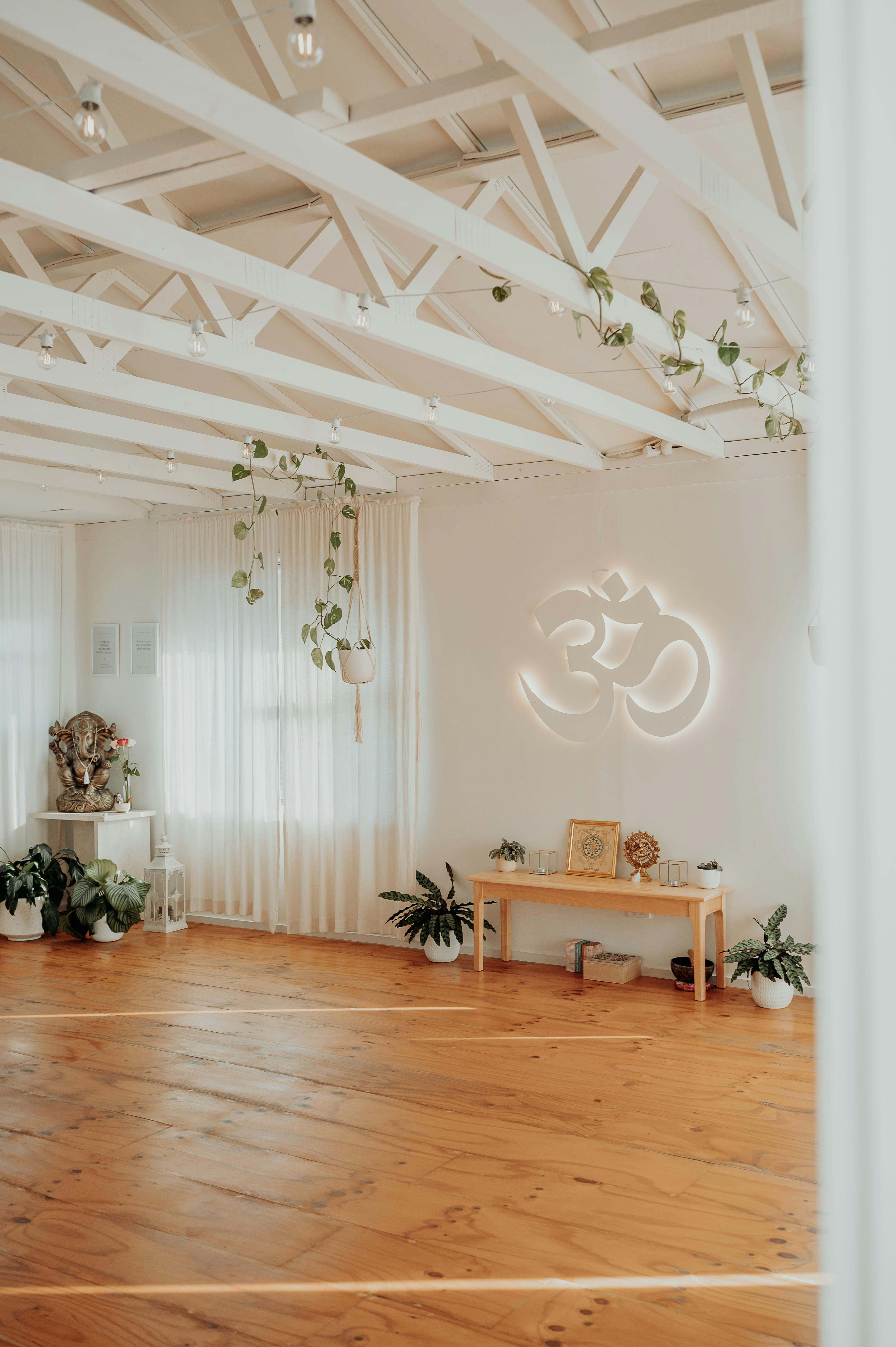 Shala Wellness yoga studio with Om sign in background