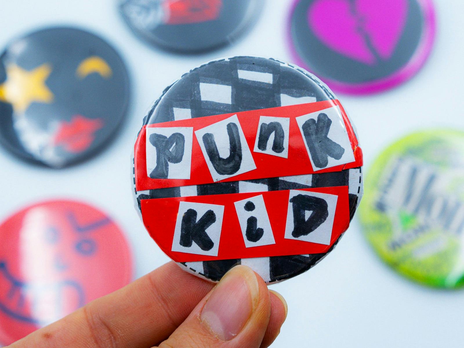 'Punk Kid' spelt out in collage letters and pasted on a badge