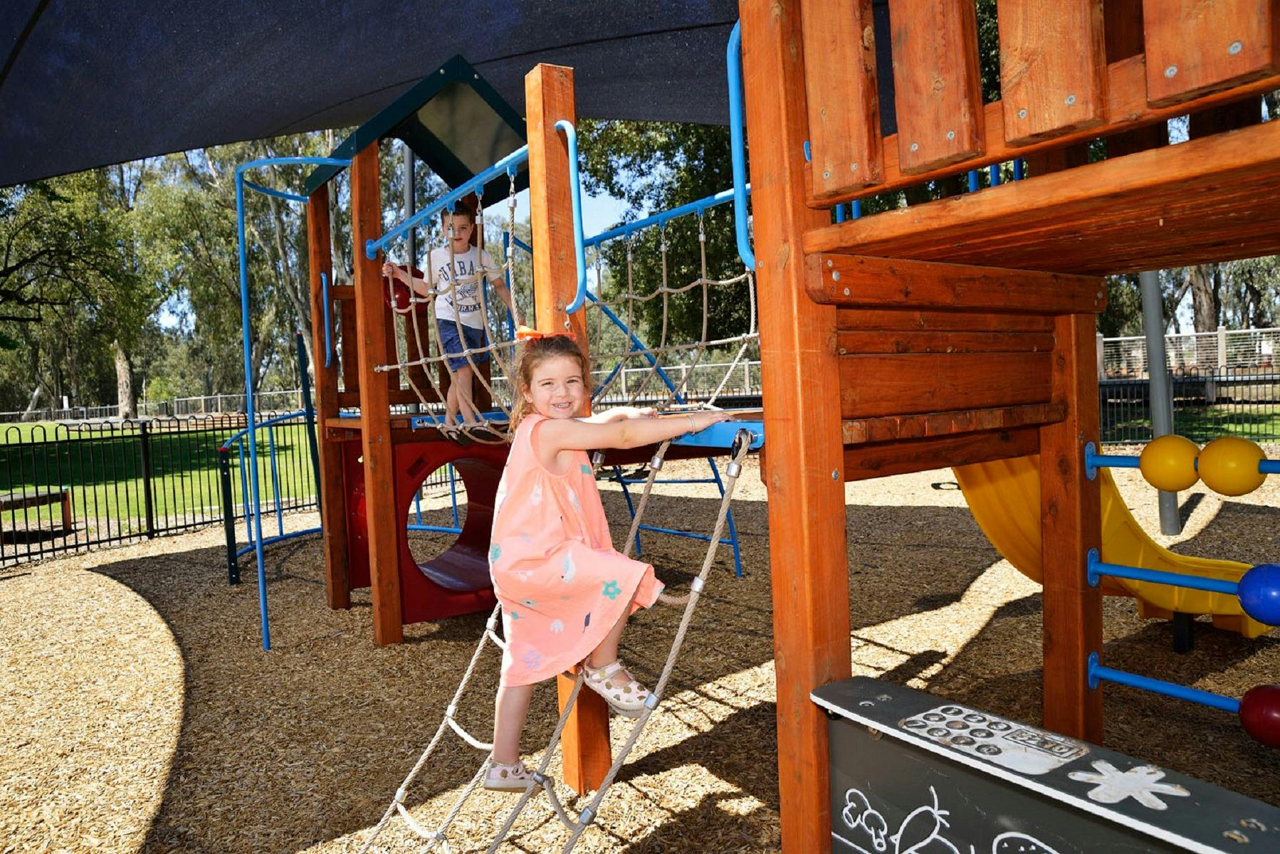 children playing on climbing frame