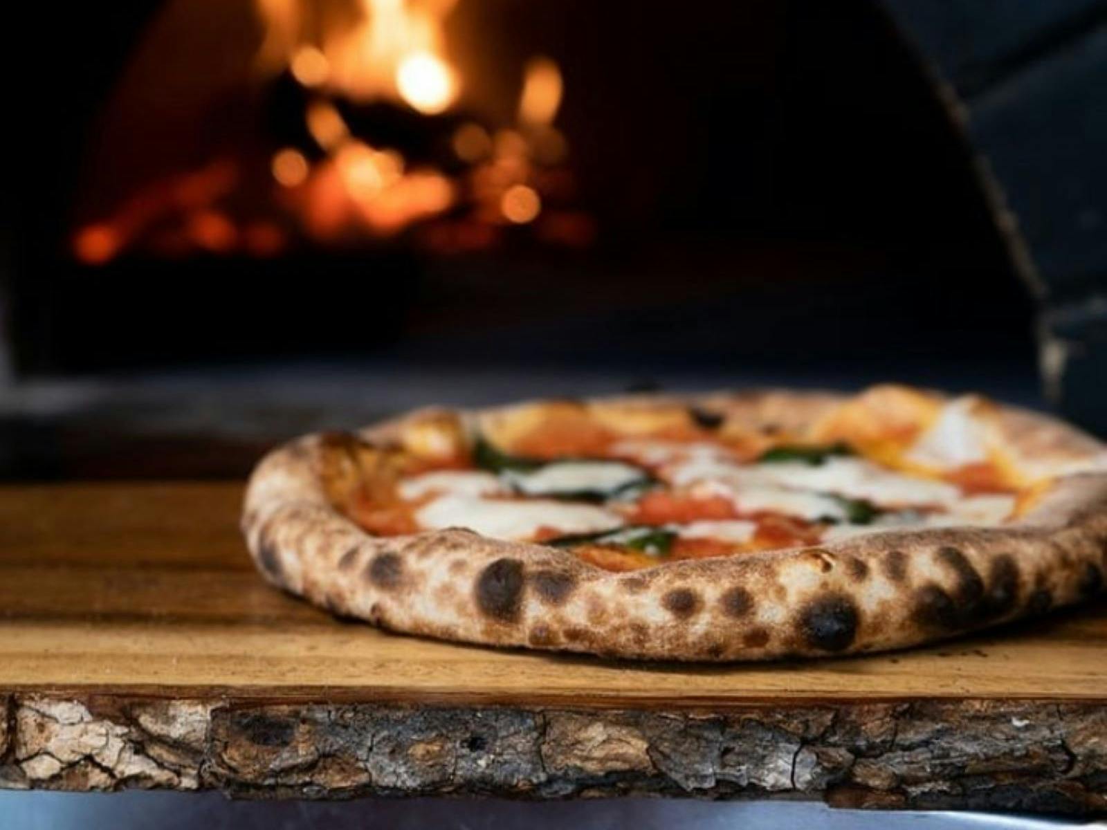 Pizza in front of oven