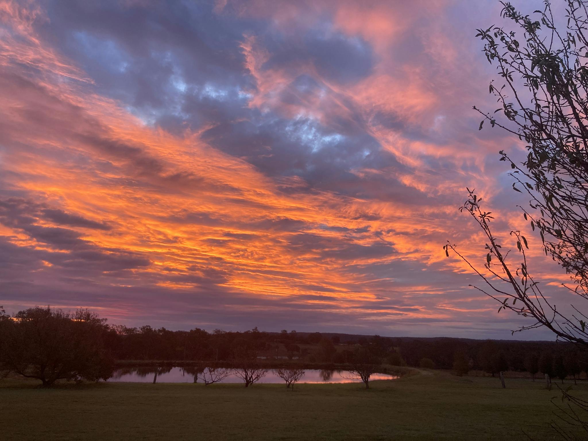 Spectacular orange sunset over dam Spectacular orange sunset over dam