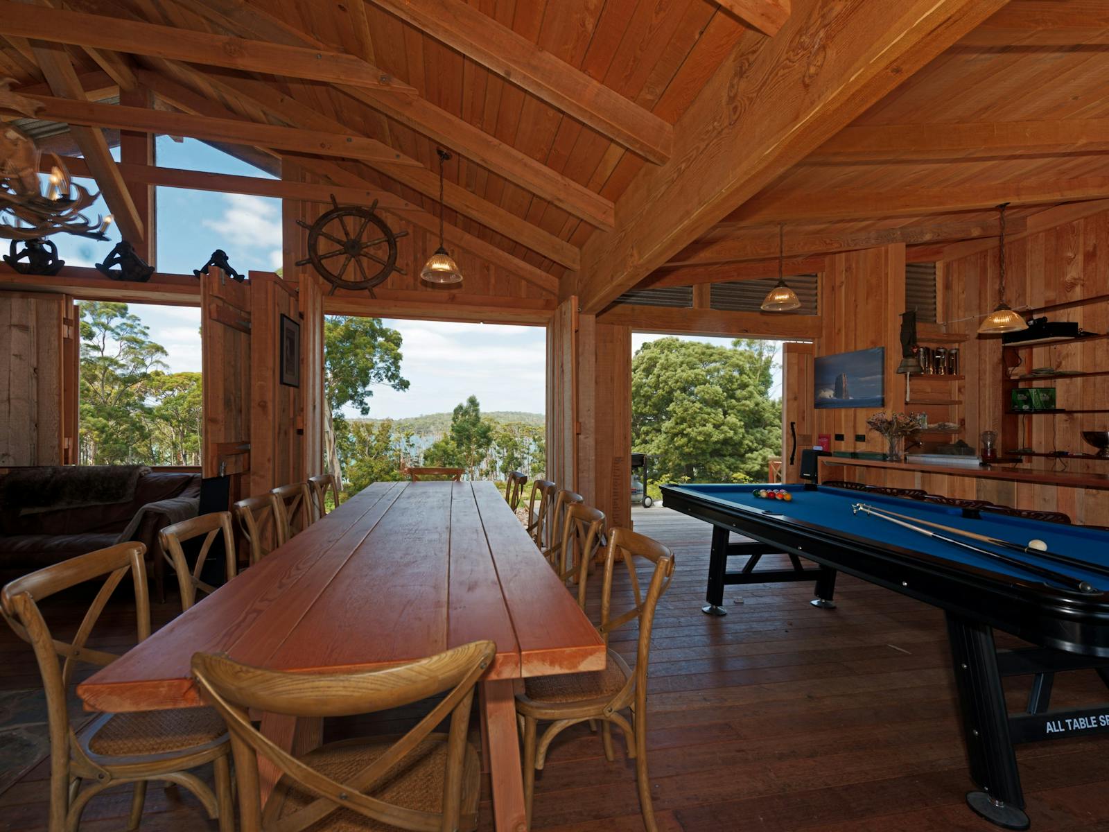 Bruny Island Lodge dining table and pool table view out to Mickeys bay