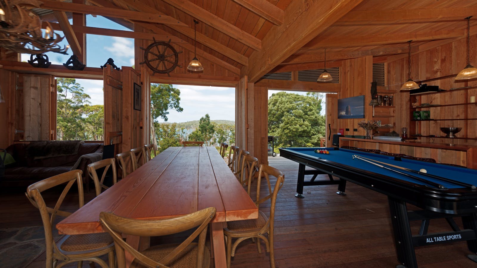 Bruny Island Lodge dining table and pool table view out to Mickeys bay