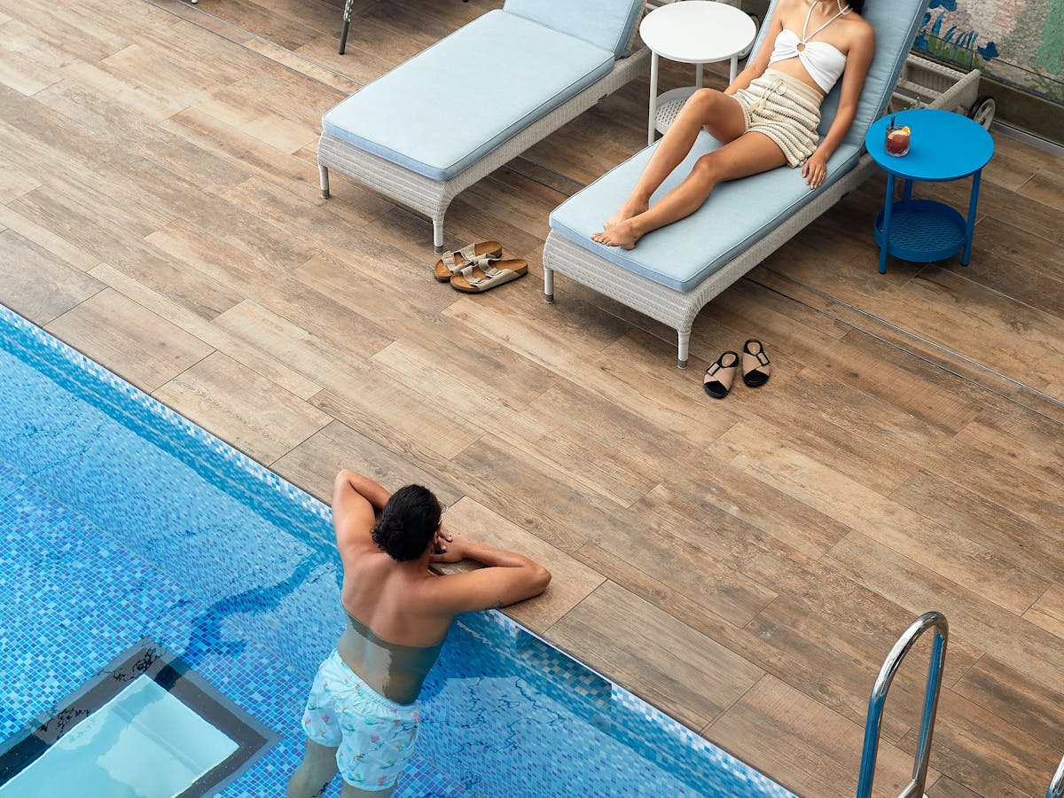 woman and man poolside