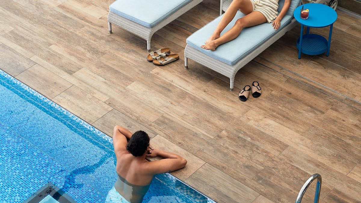 woman and man poolside