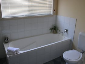 bath and toilet in a bathroom