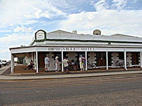 Tour guests outside the Birdsville Pub Hotel